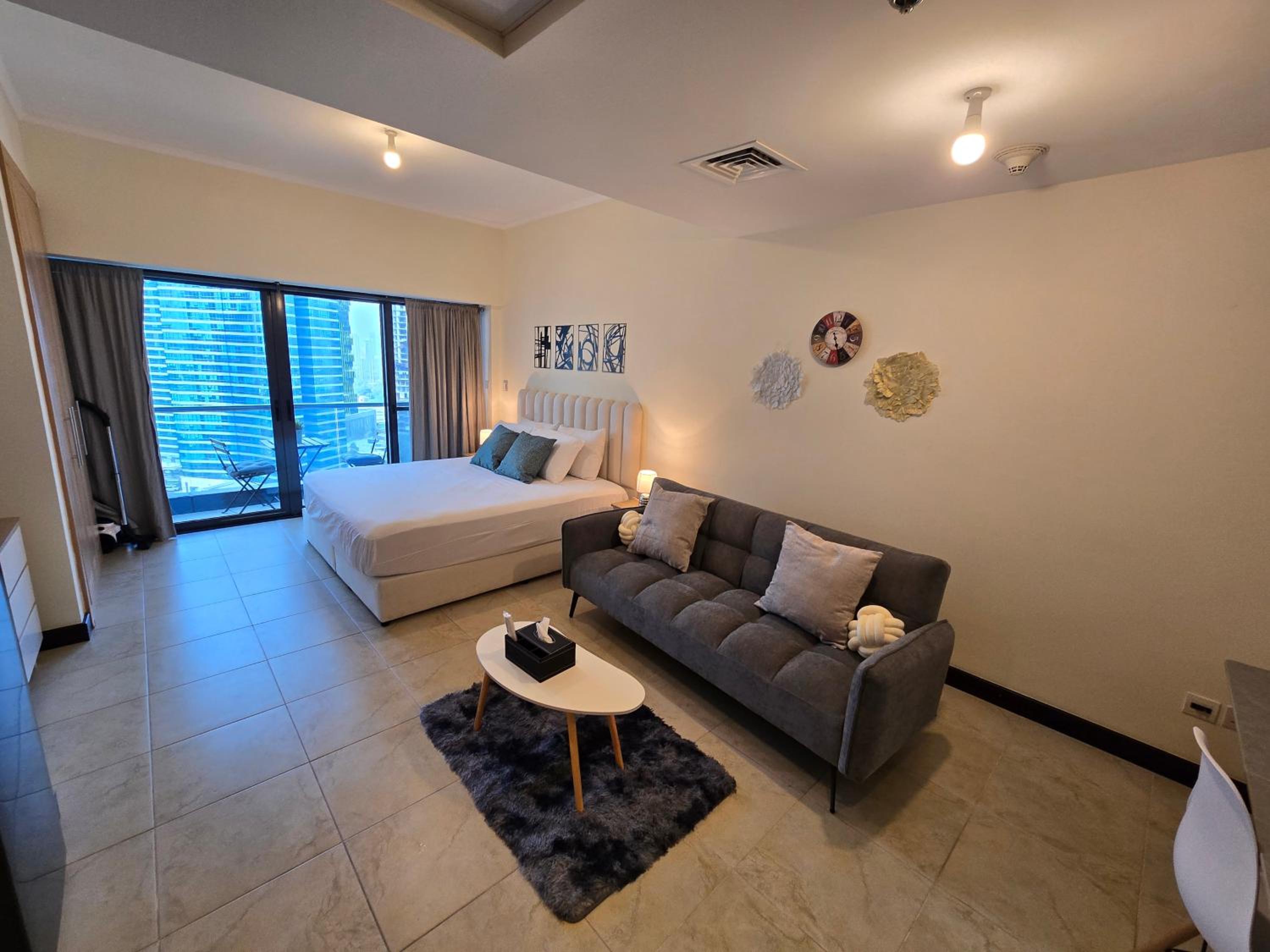Click Stay - JLT - Entire Studio & Balcony Lakes view Apartment -NA