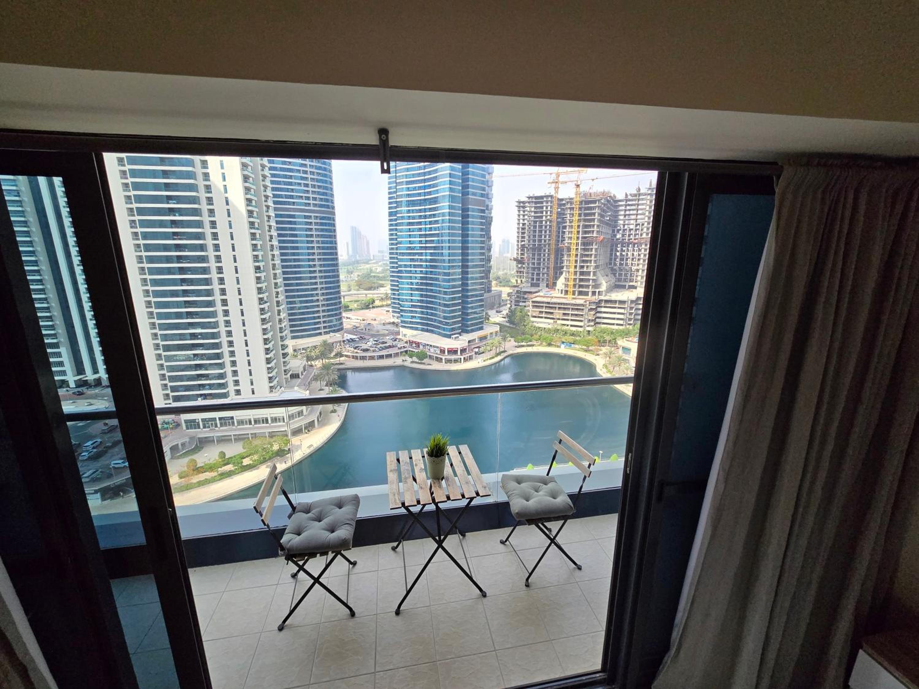 Click Stay - JLT - Entire Studio & Balcony Lakes view Apartment -NA