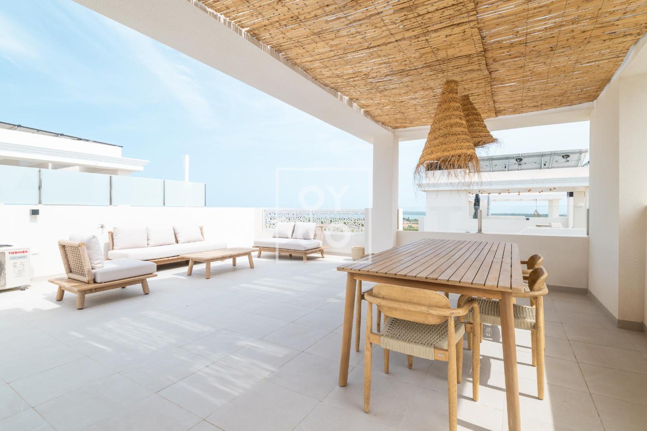 The Q Penthouse, apt with boho-chic rooftop, by OYOOSTAYS