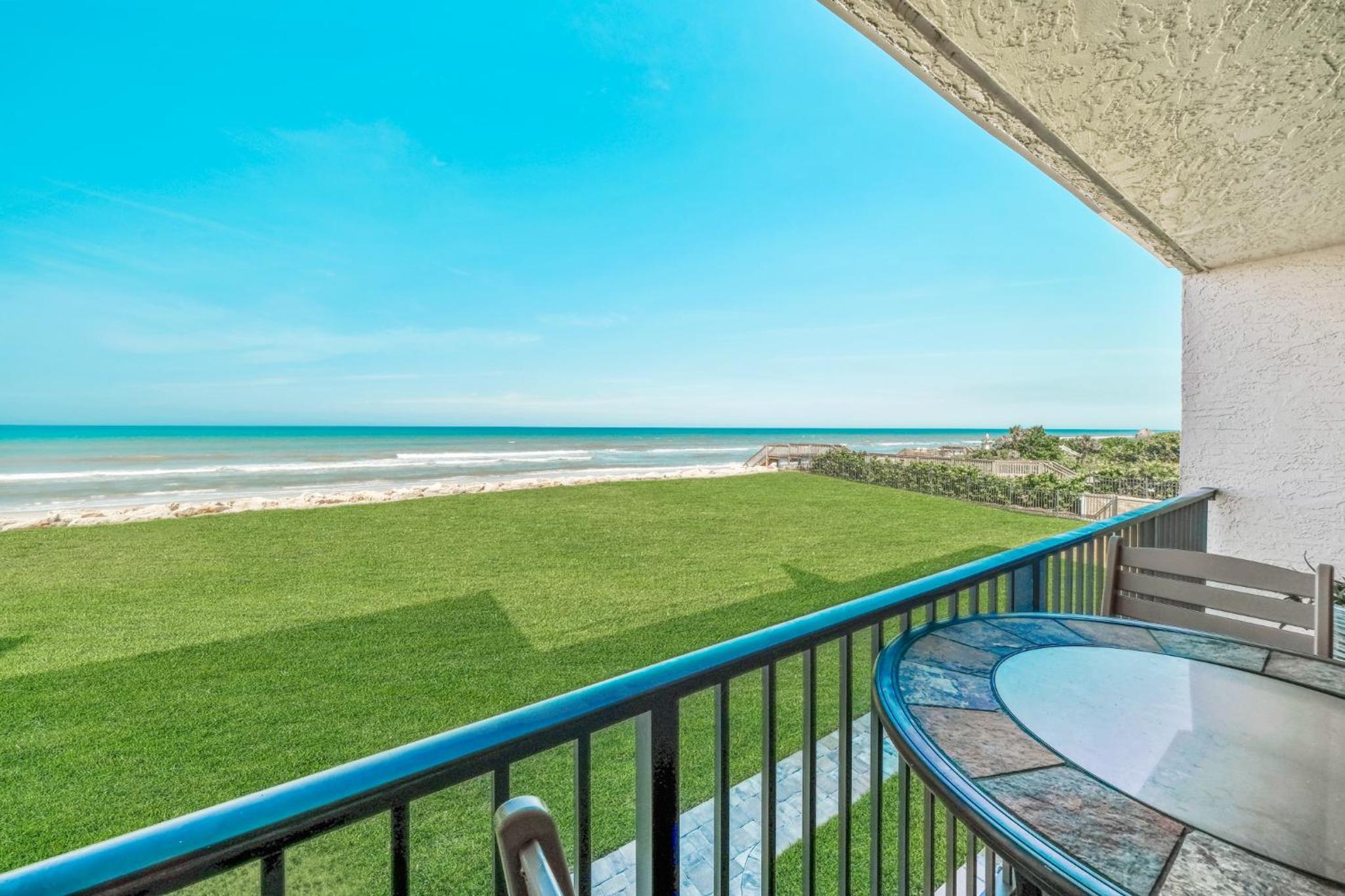 Updated direct oceanfront condo with large private balcony and a beachfront pool