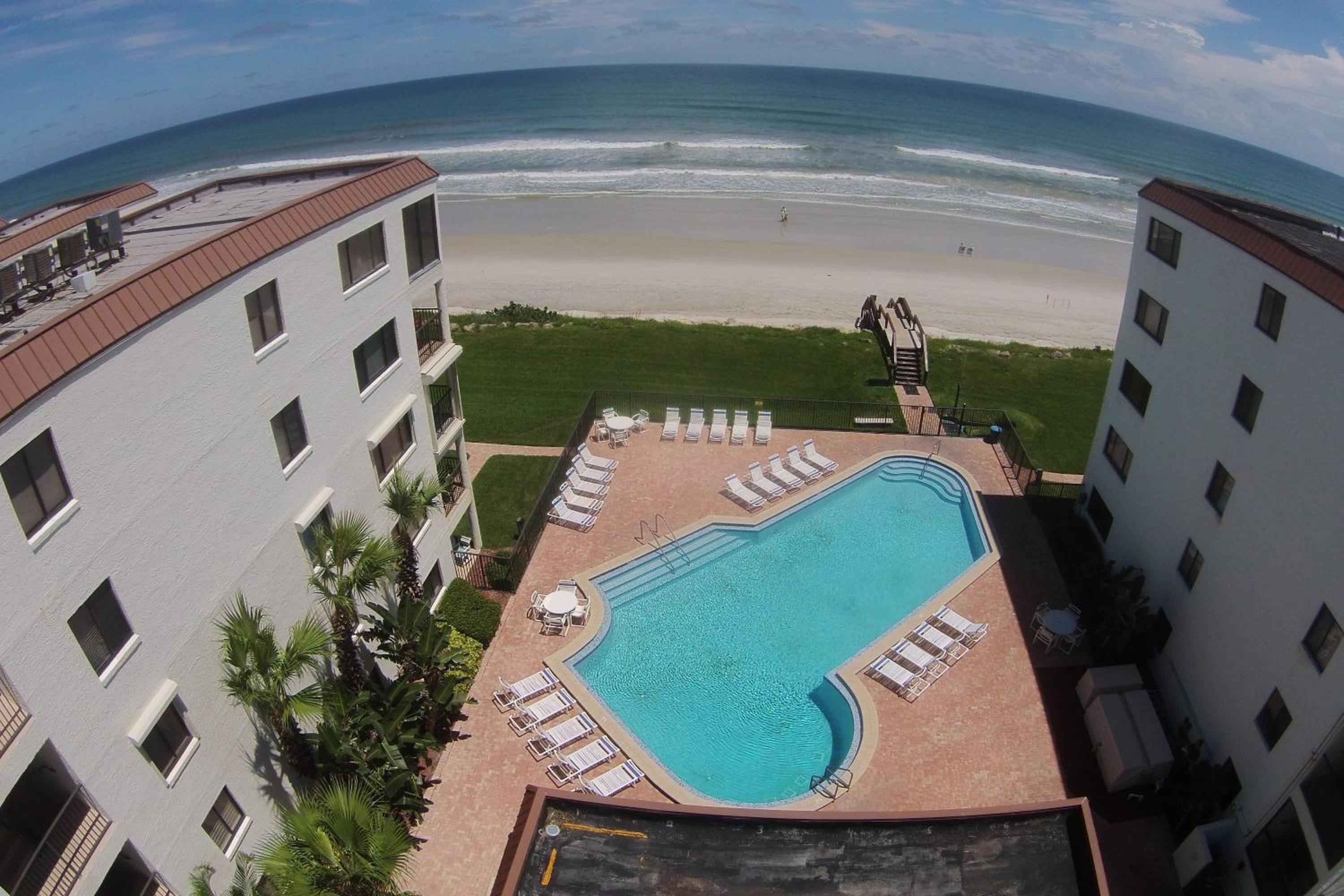 Updated direct oceanfront condo with large private balcony and a beachfront pool