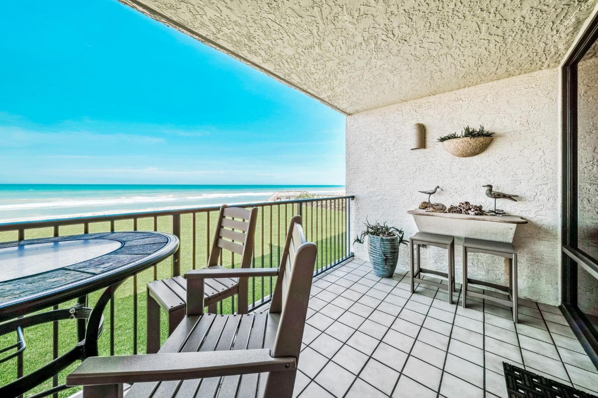 Updated direct oceanfront condo with large private balcony and a beachfront pool