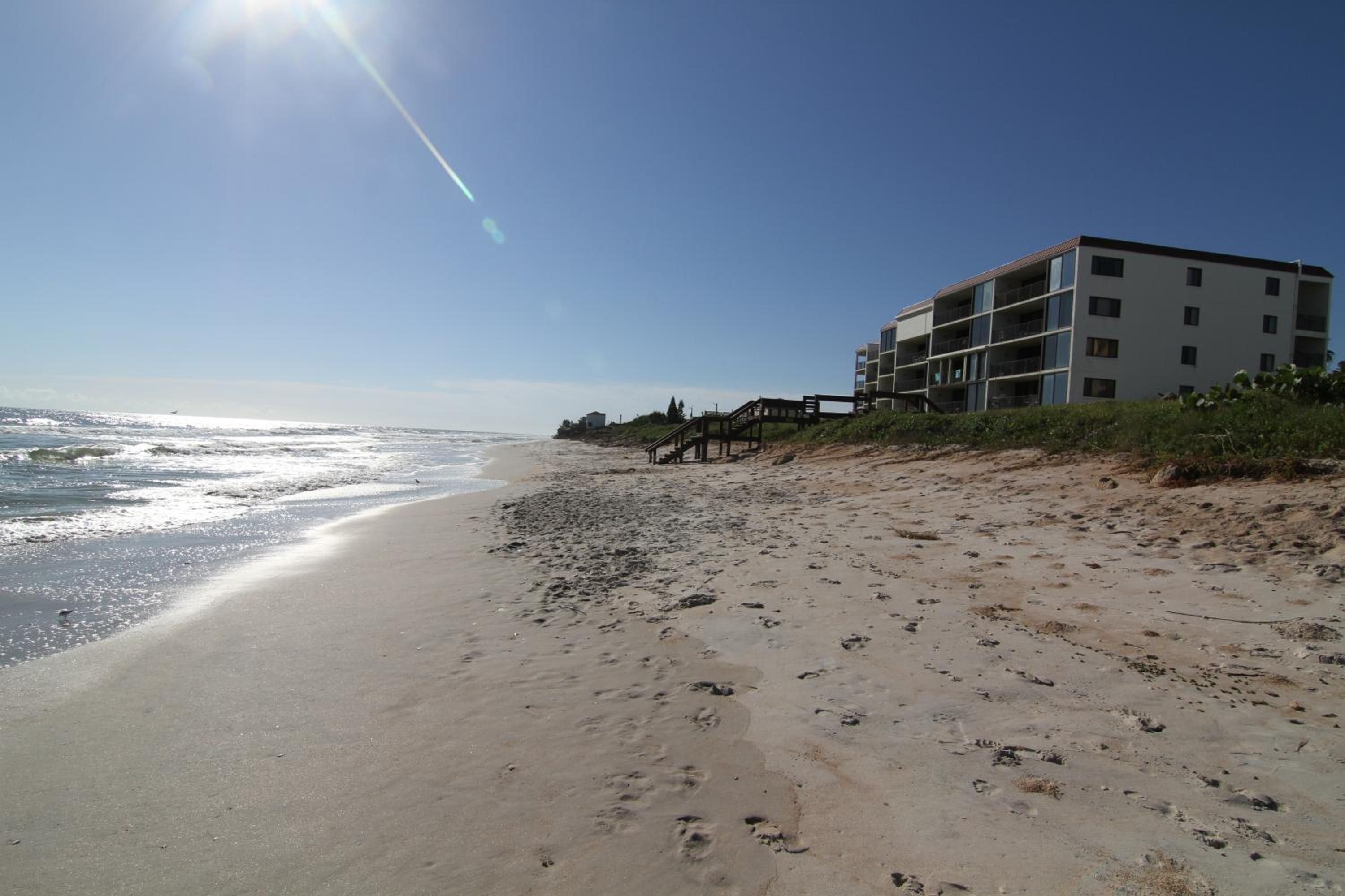 Updated direct oceanfront condo with large private balcony and a beachfront pool