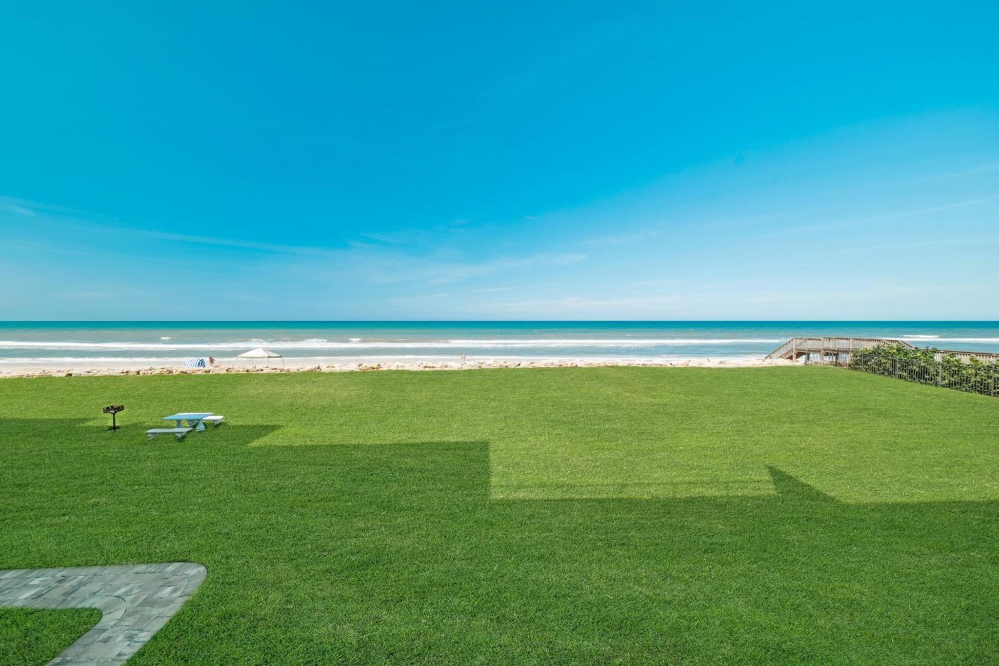 Updated direct oceanfront condo with large private balcony and a beachfront pool