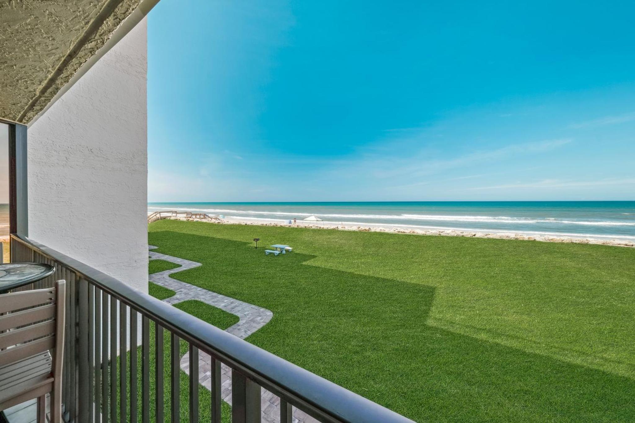 Updated direct oceanfront condo with large private balcony and a beachfront pool