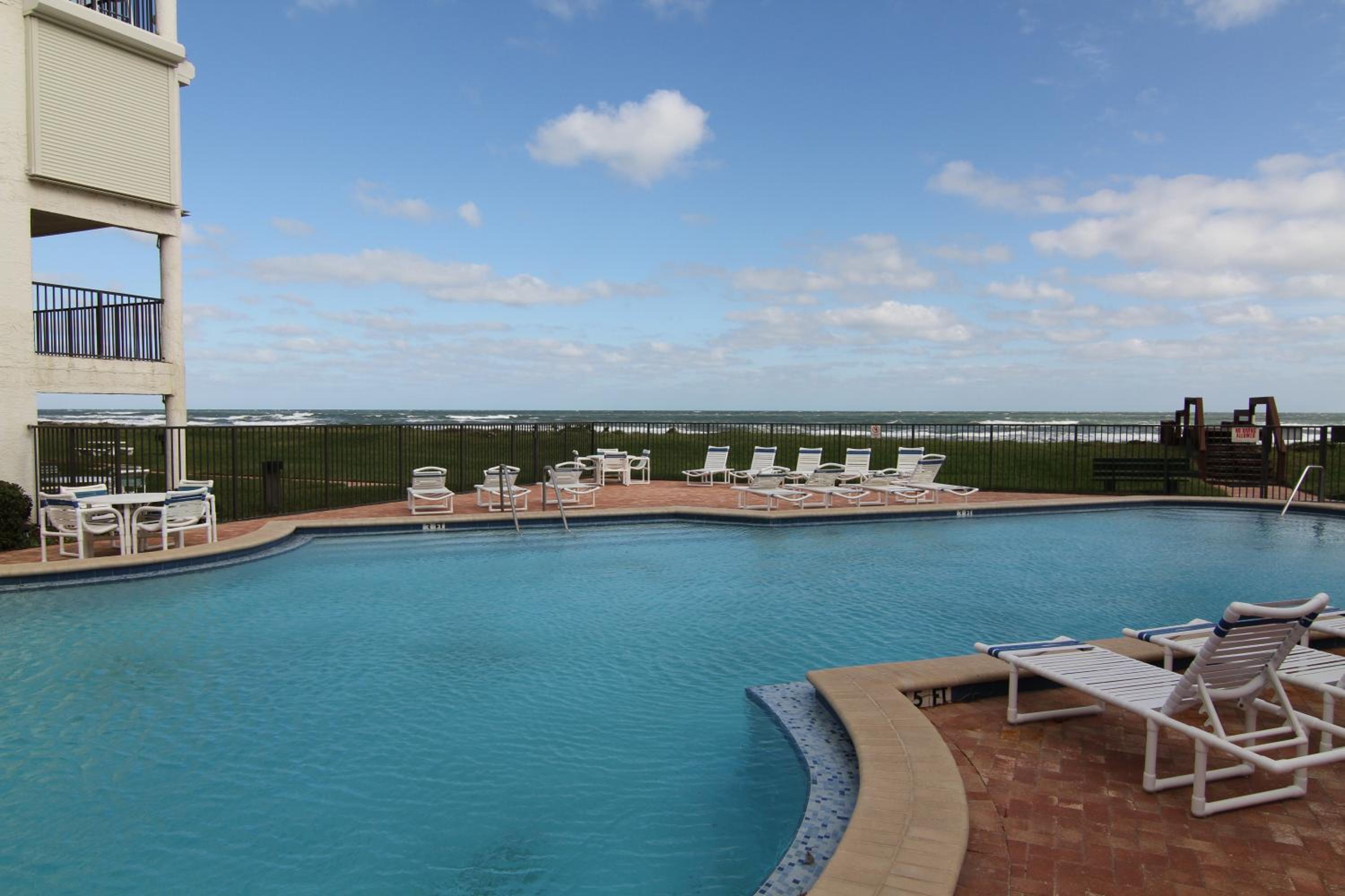 Updated direct oceanfront condo with large private balcony and a beachfront pool