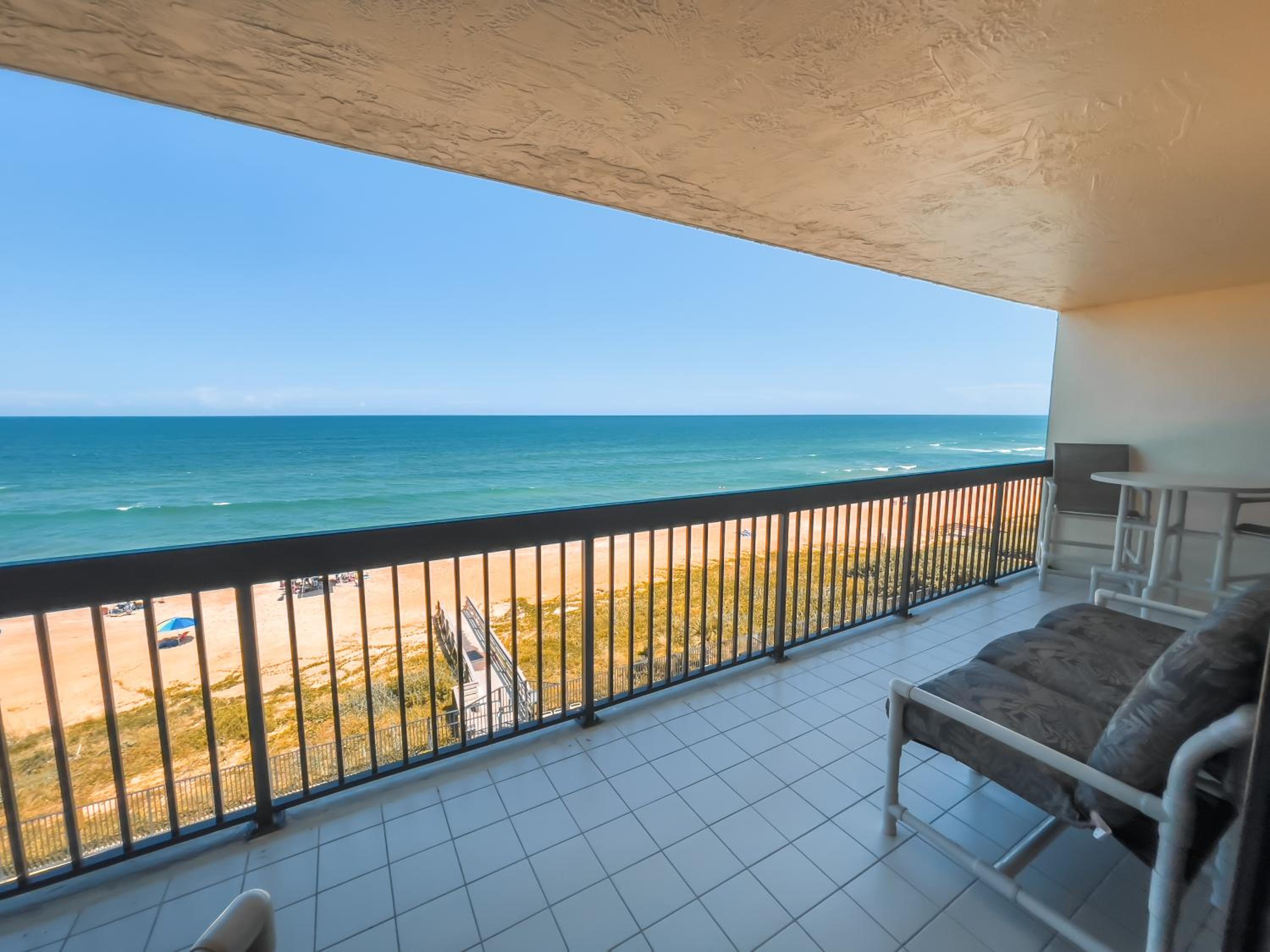 Luxury direct oceanfront corner with a large private balcony, heated pool and garage