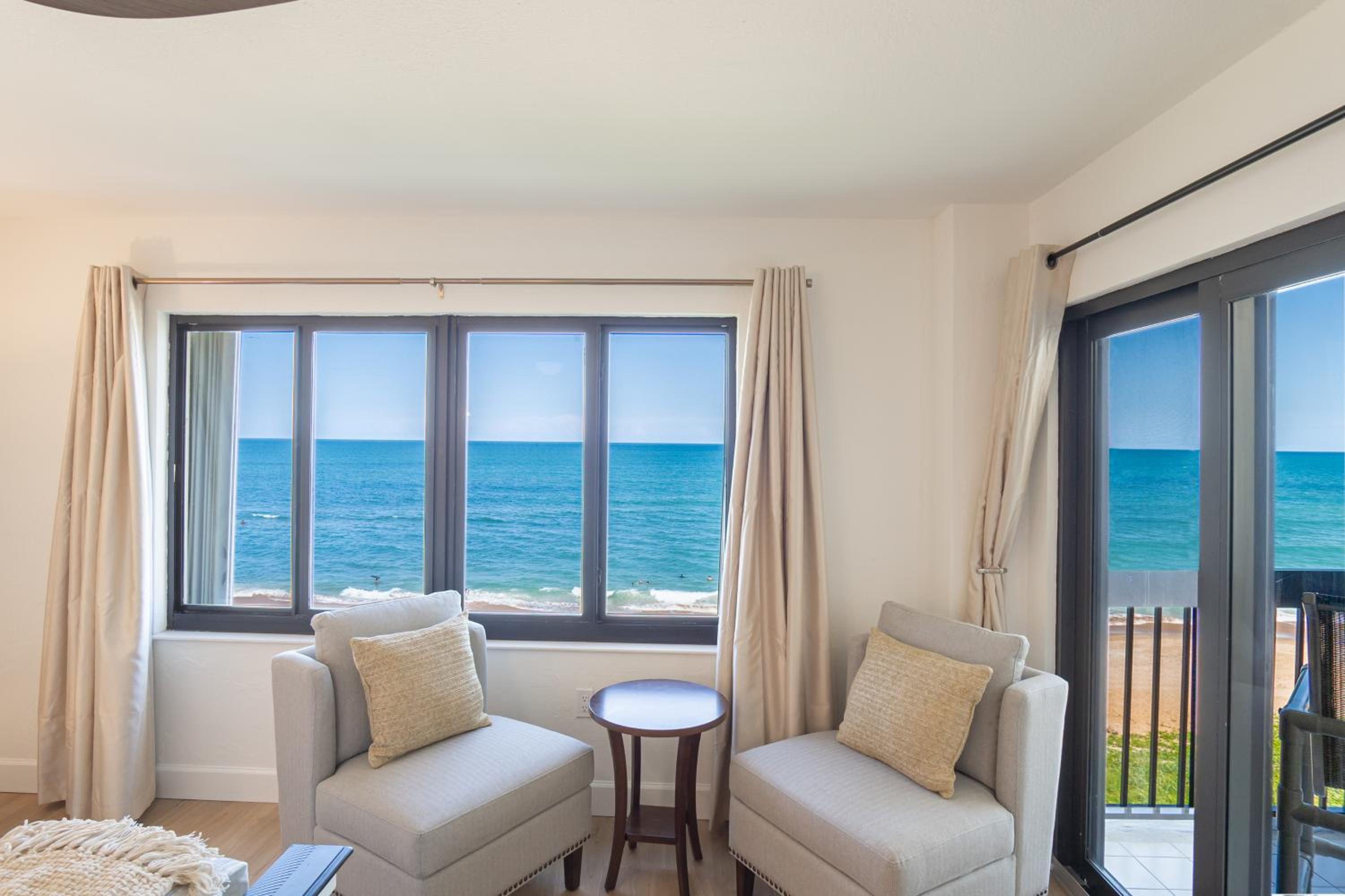 Luxury direct oceanfront corner with a large private balcony, heated pool and garage