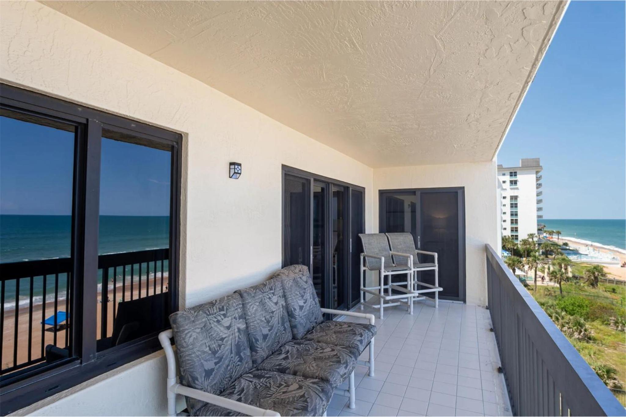 Luxury direct oceanfront corner with a large private balcony, heated pool and garage