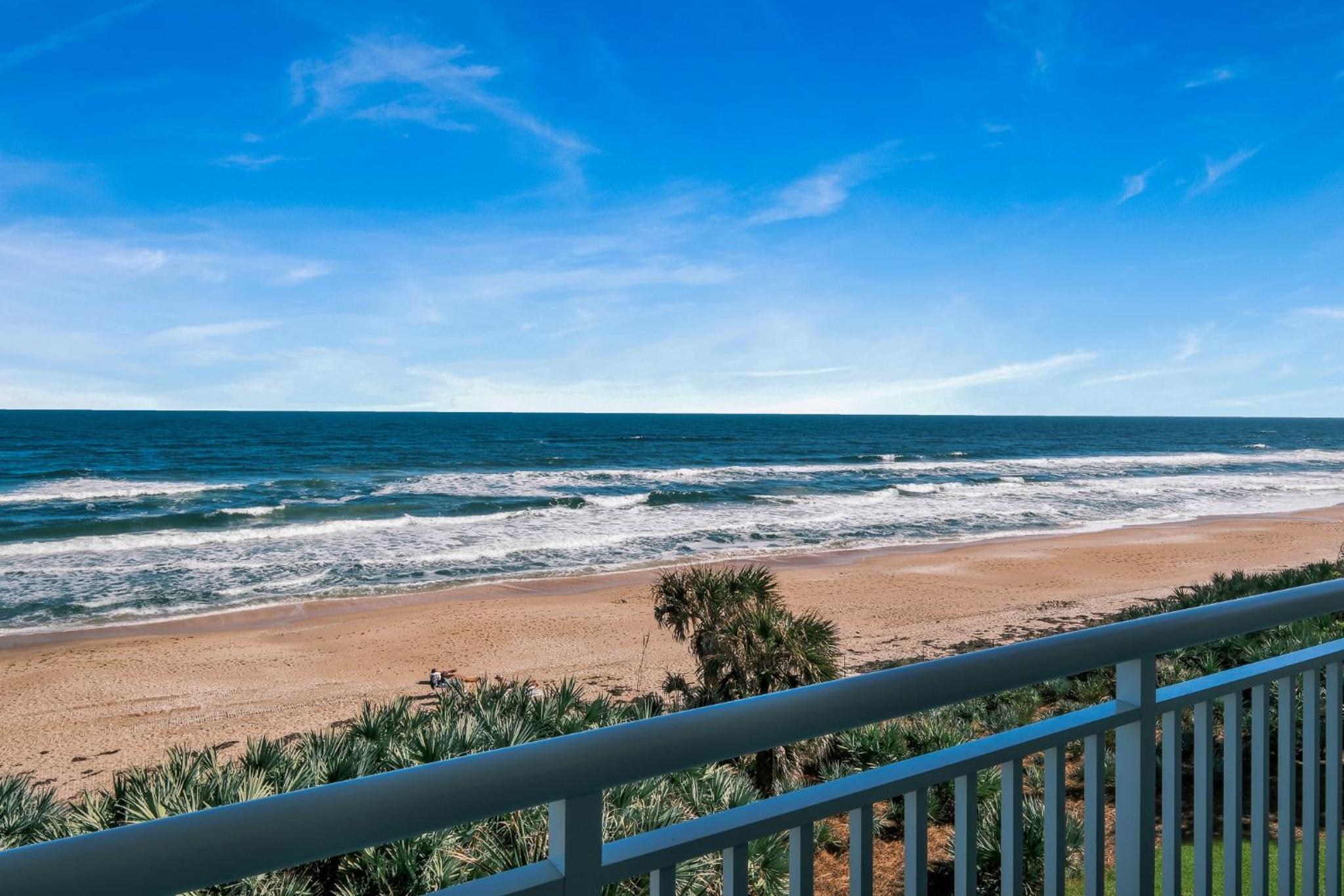 Updated direct oceanfront condo with a balcony, beachfront heated pool and beach access