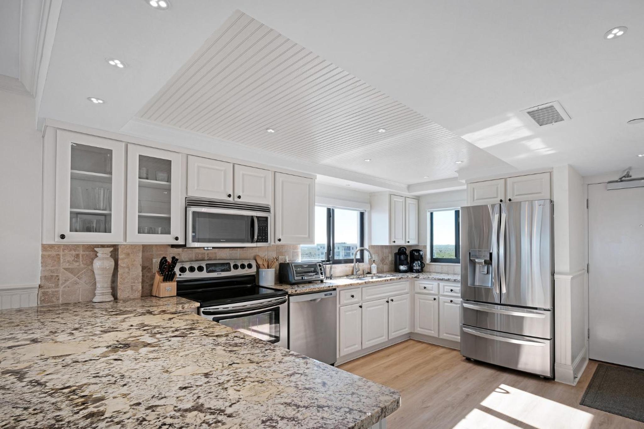 Luxury, direct oceanfront top-floor corner with wrap-around balcony and heated pool