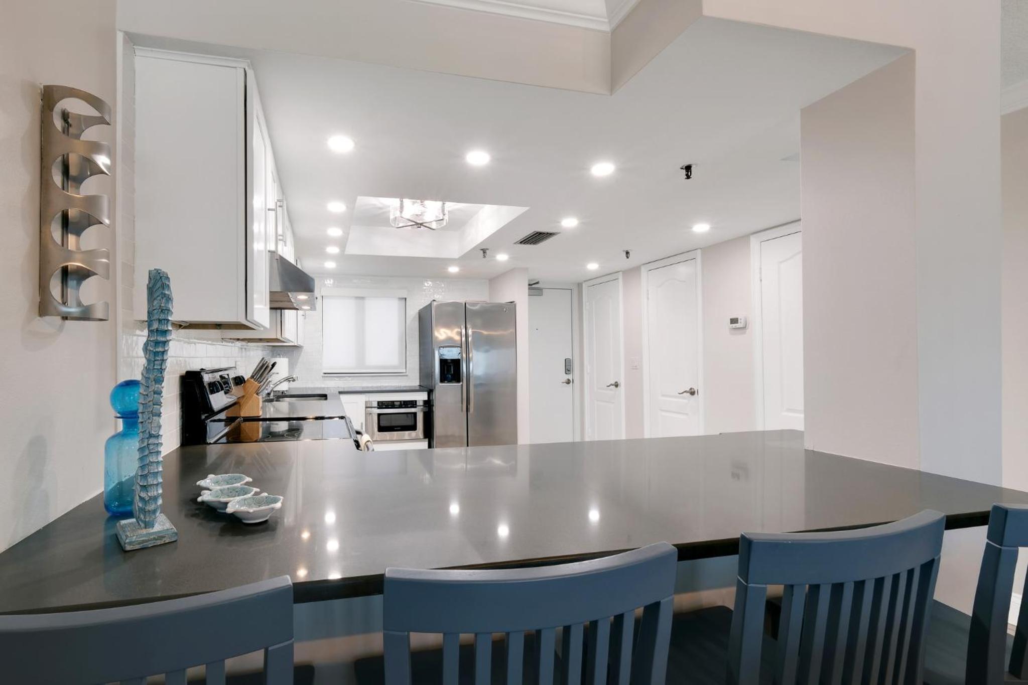 Updated direct oceanfront condo with a balcony, beachfront heated pool and beach access