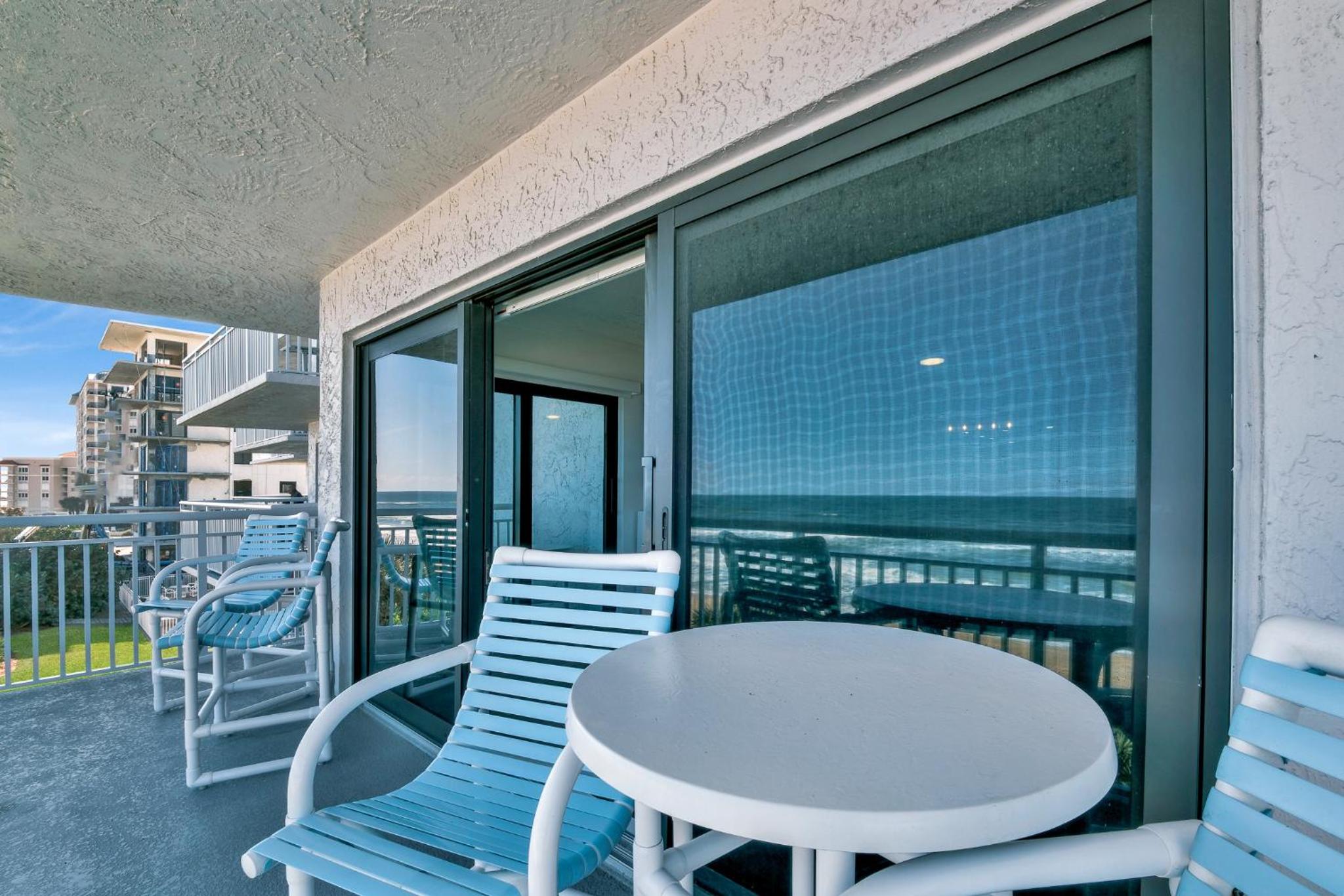 Updated direct oceanfront condo with a balcony, beachfront heated pool and beach access