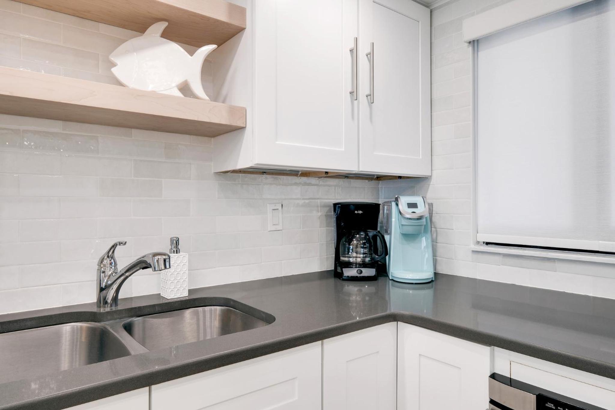Updated direct oceanfront condo with a balcony, beachfront heated pool and beach access
