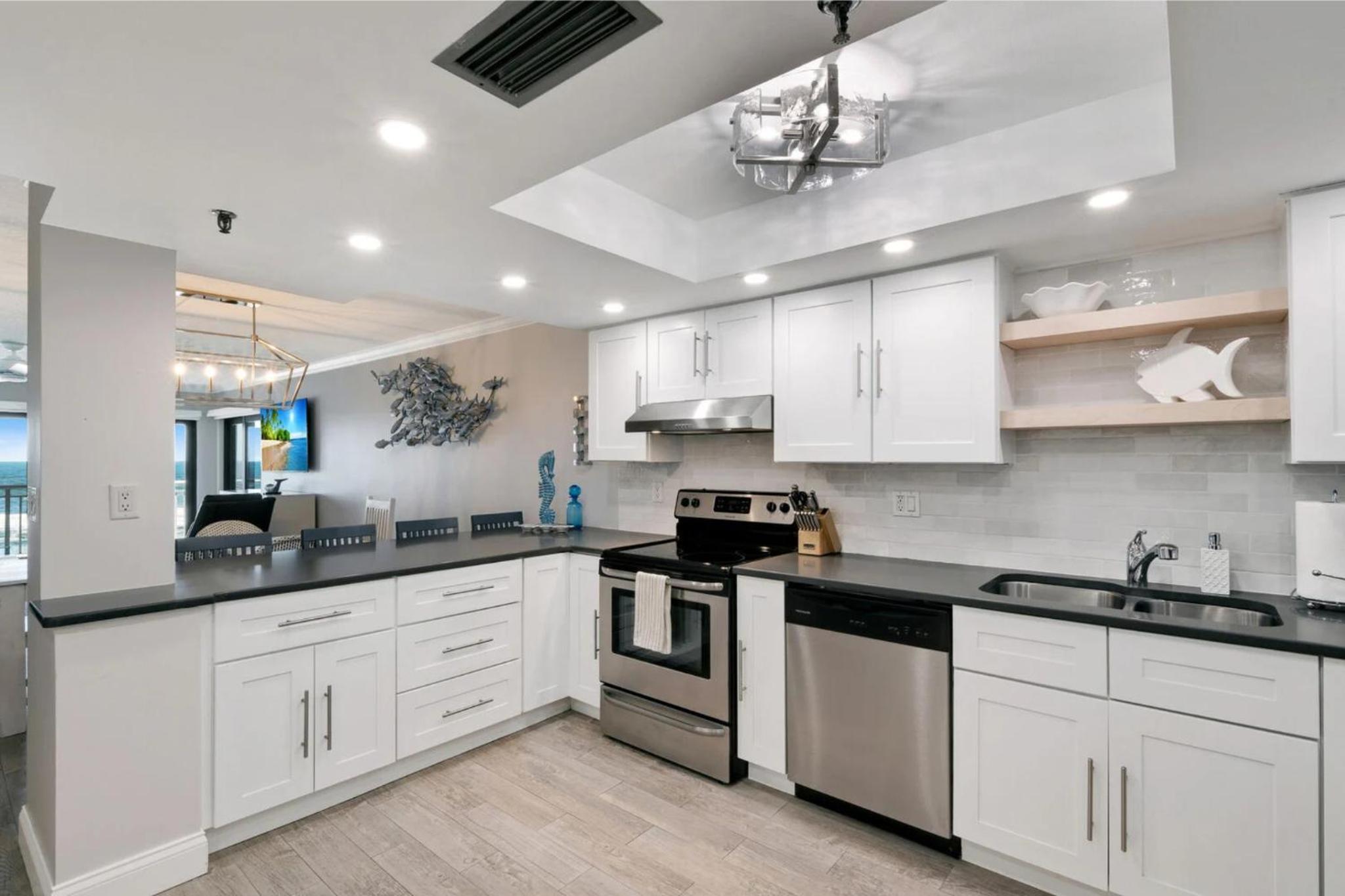 Updated direct oceanfront condo with a balcony, beachfront heated pool and beach access