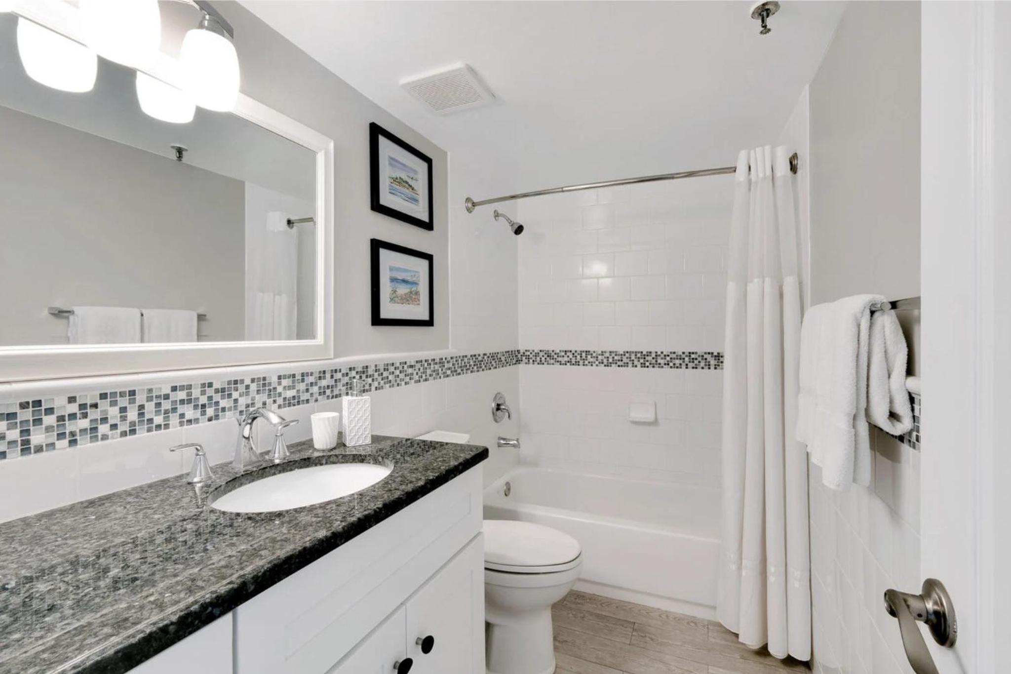Updated direct oceanfront condo with a balcony, beachfront heated pool and beach access