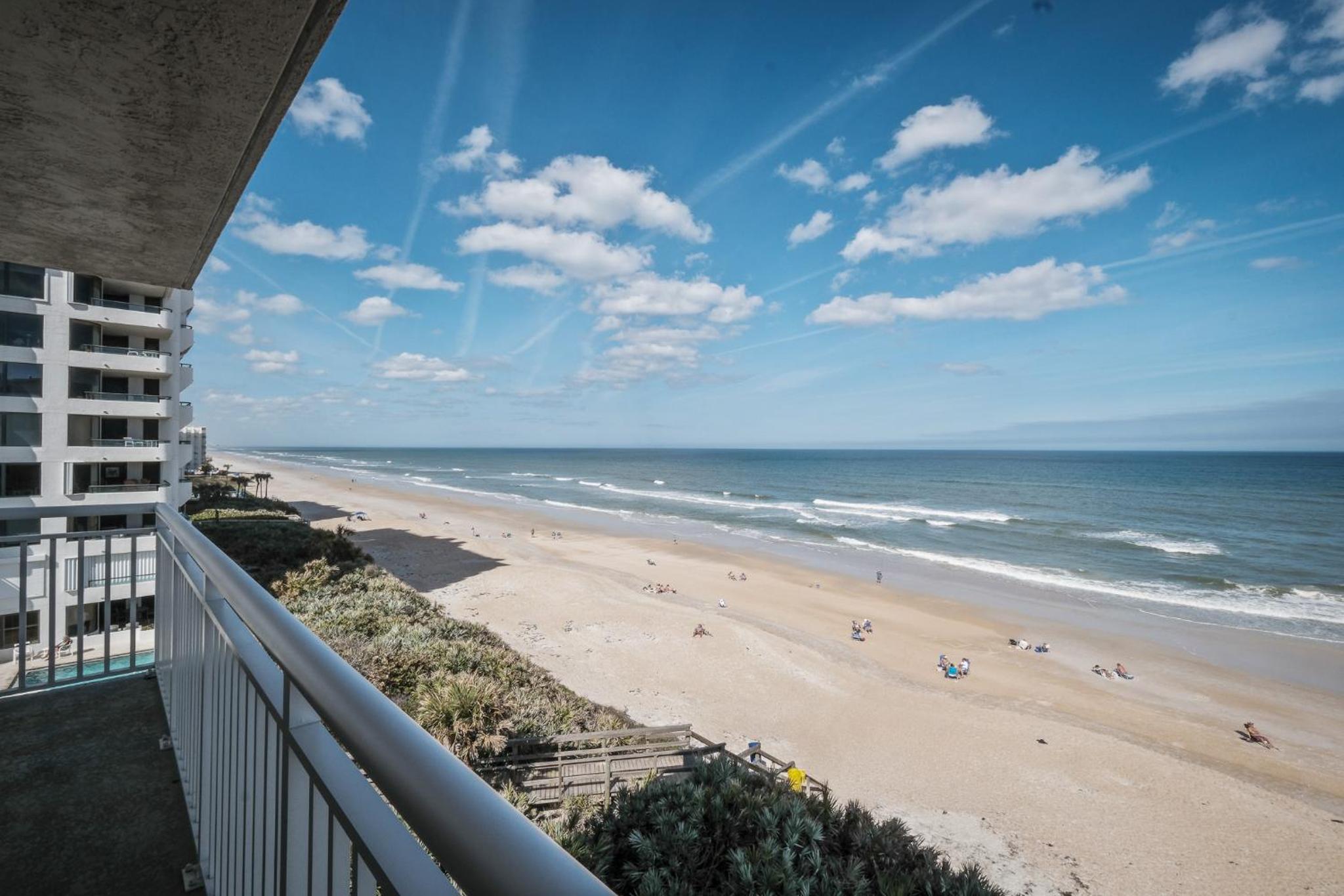 Renovated direct oceanfront corner condo with a huge wrap-around balcony and pool