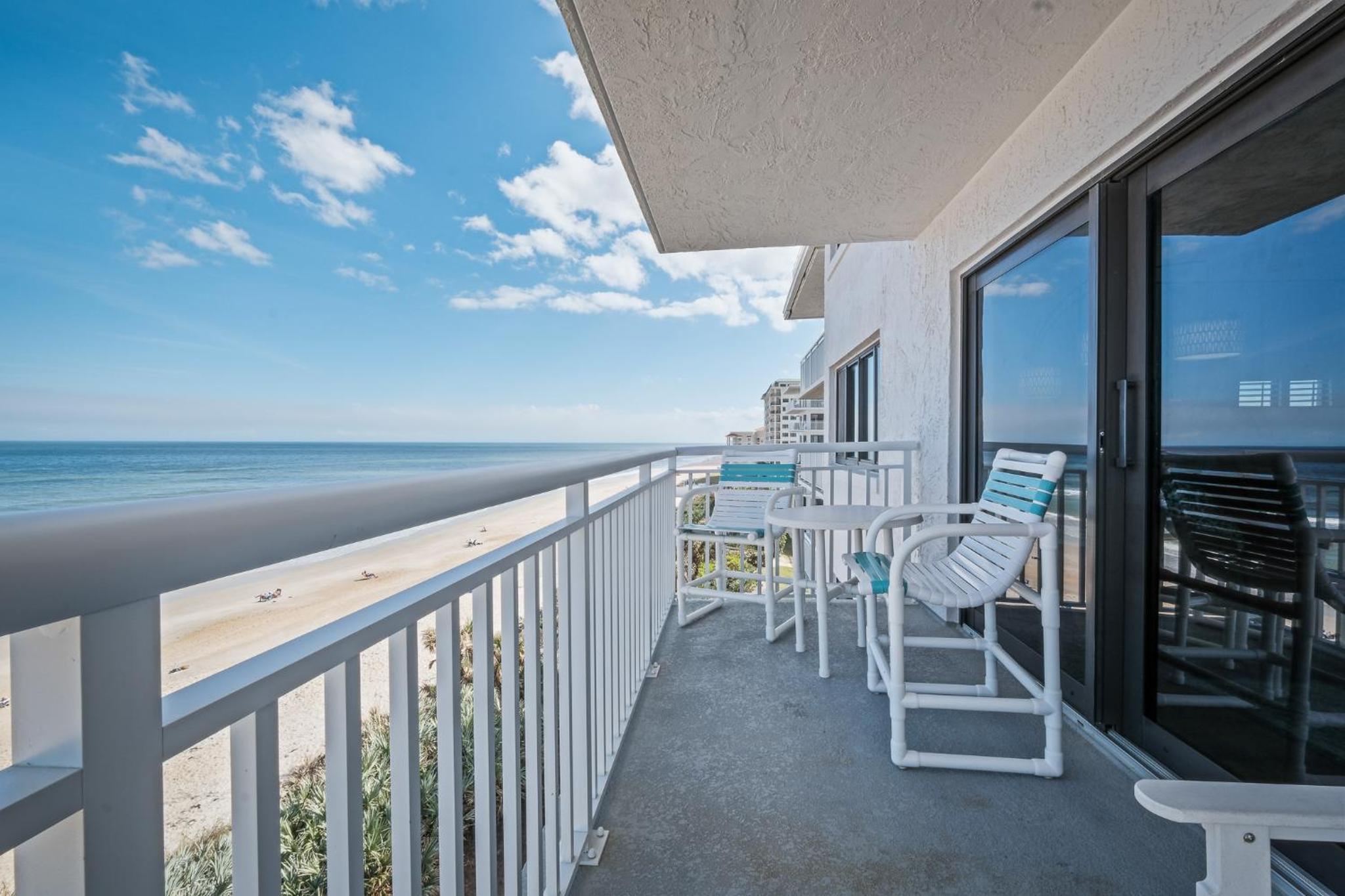 Renovated direct oceanfront corner condo with a huge wrap-around balcony and pool