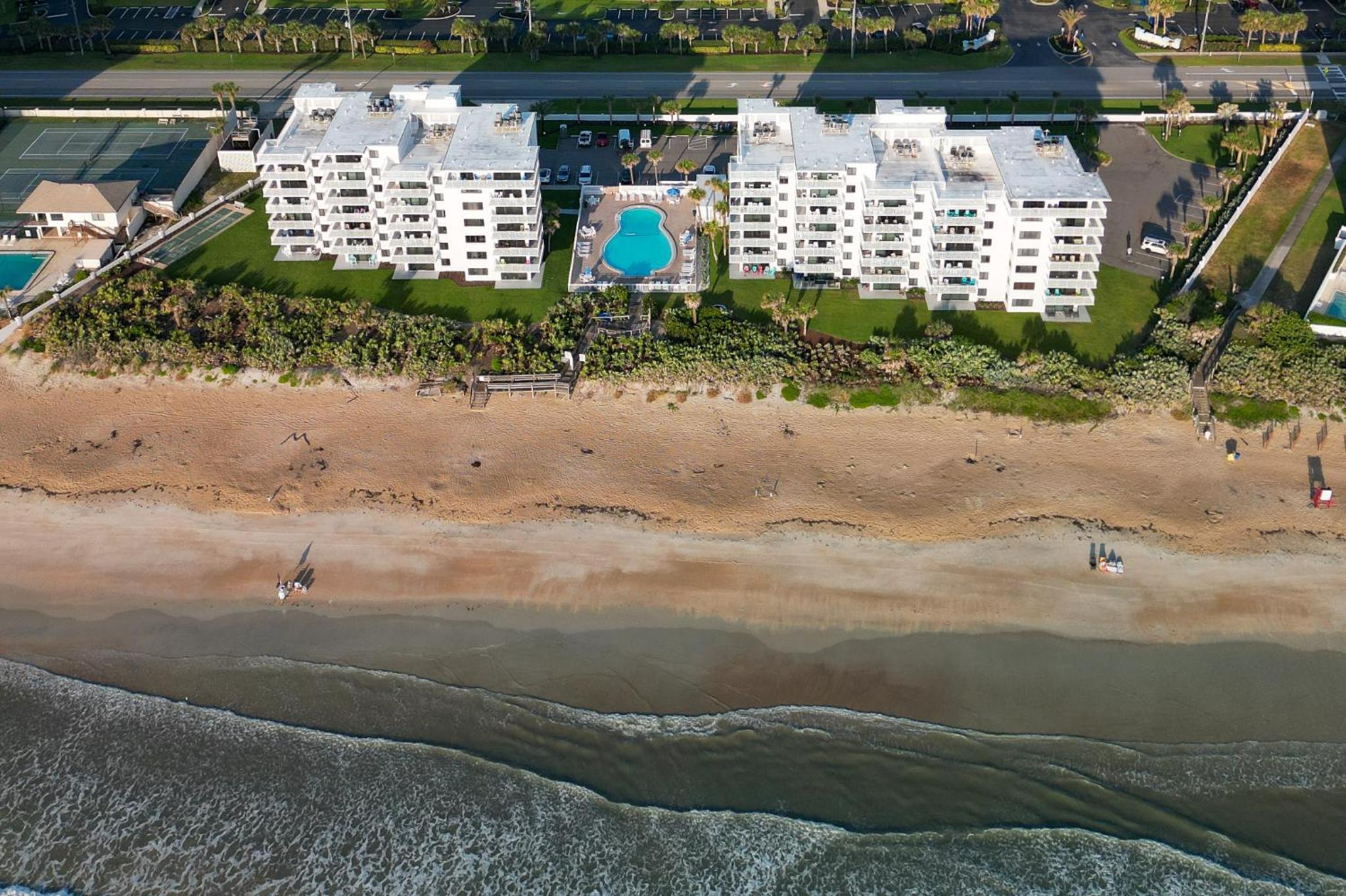 Renovated direct oceanfront corner condo with a huge wrap-around balcony and pool