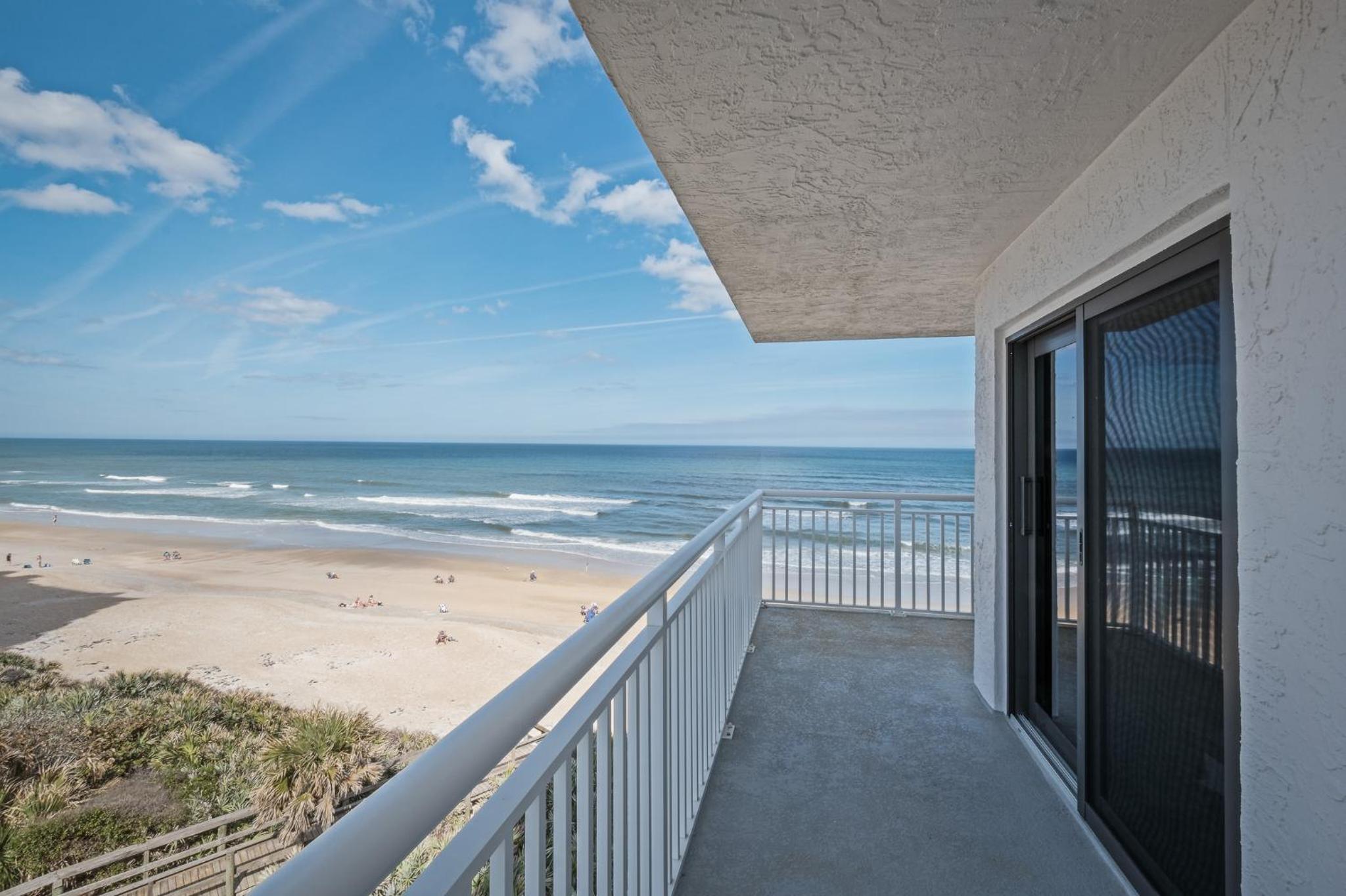Renovated direct oceanfront corner condo with a huge wrap-around balcony and pool