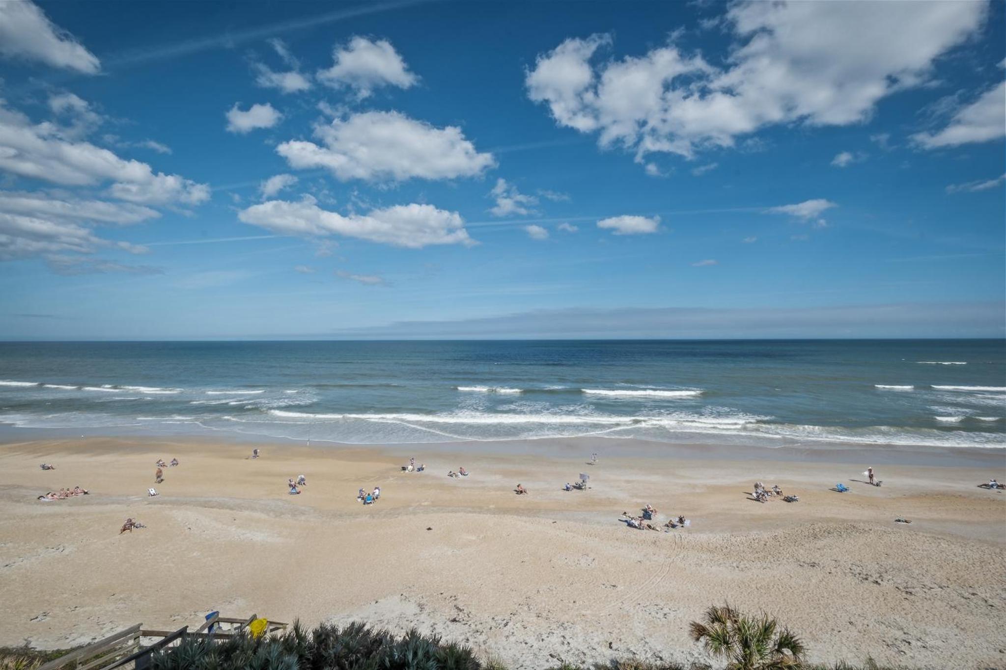 Renovated direct oceanfront corner condo with a huge wrap-around balcony and pool