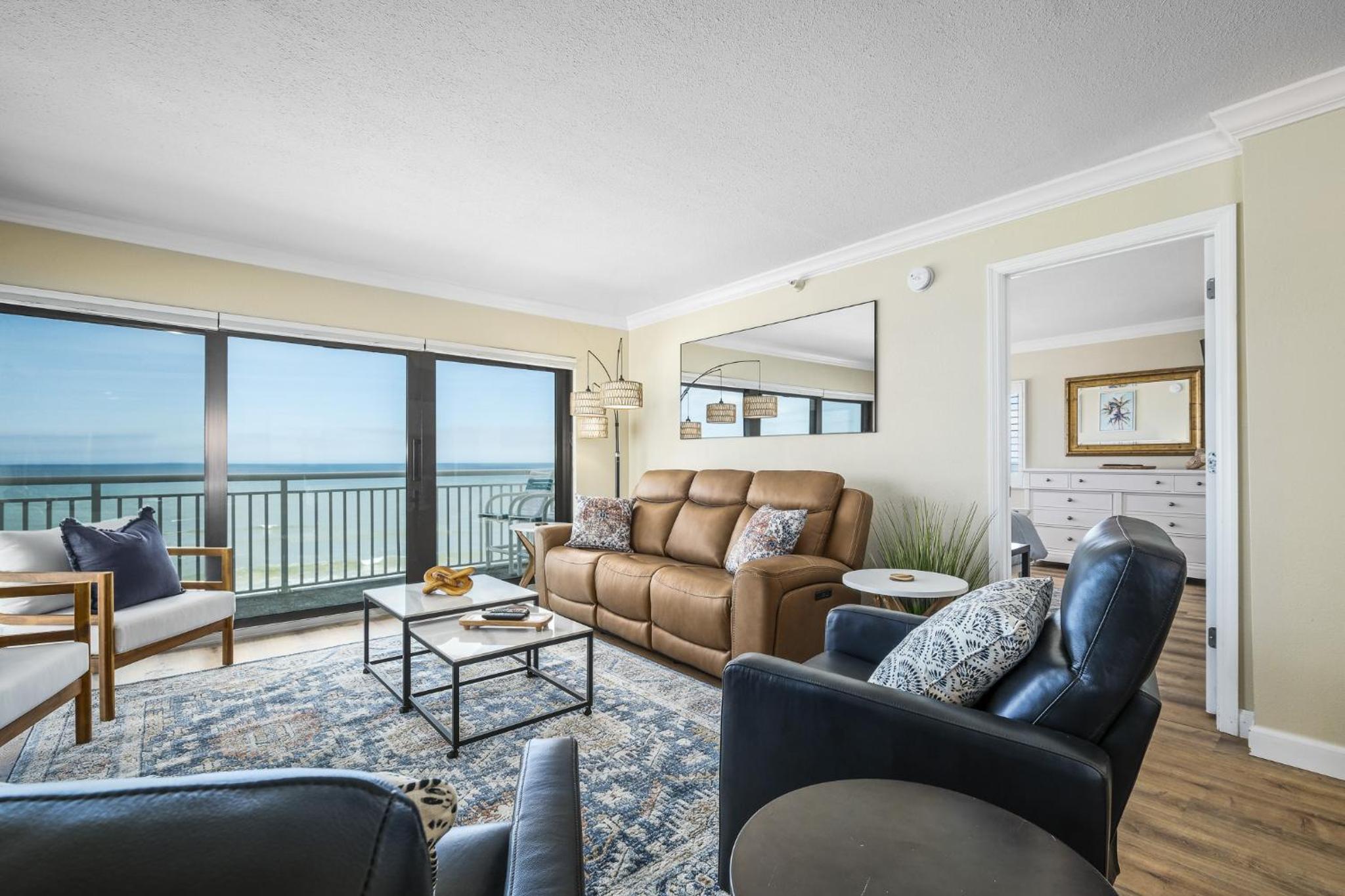 Renovated direct oceanfront corner condo with a huge wrap-around balcony and pool