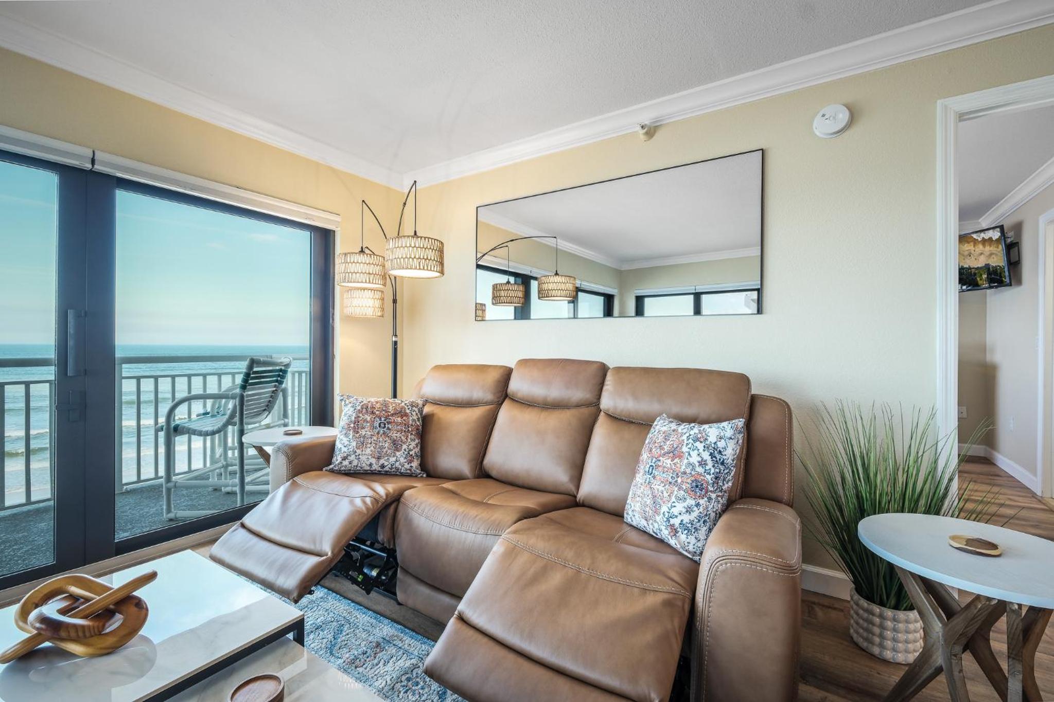 Renovated direct oceanfront corner condo with a huge wrap-around balcony and pool