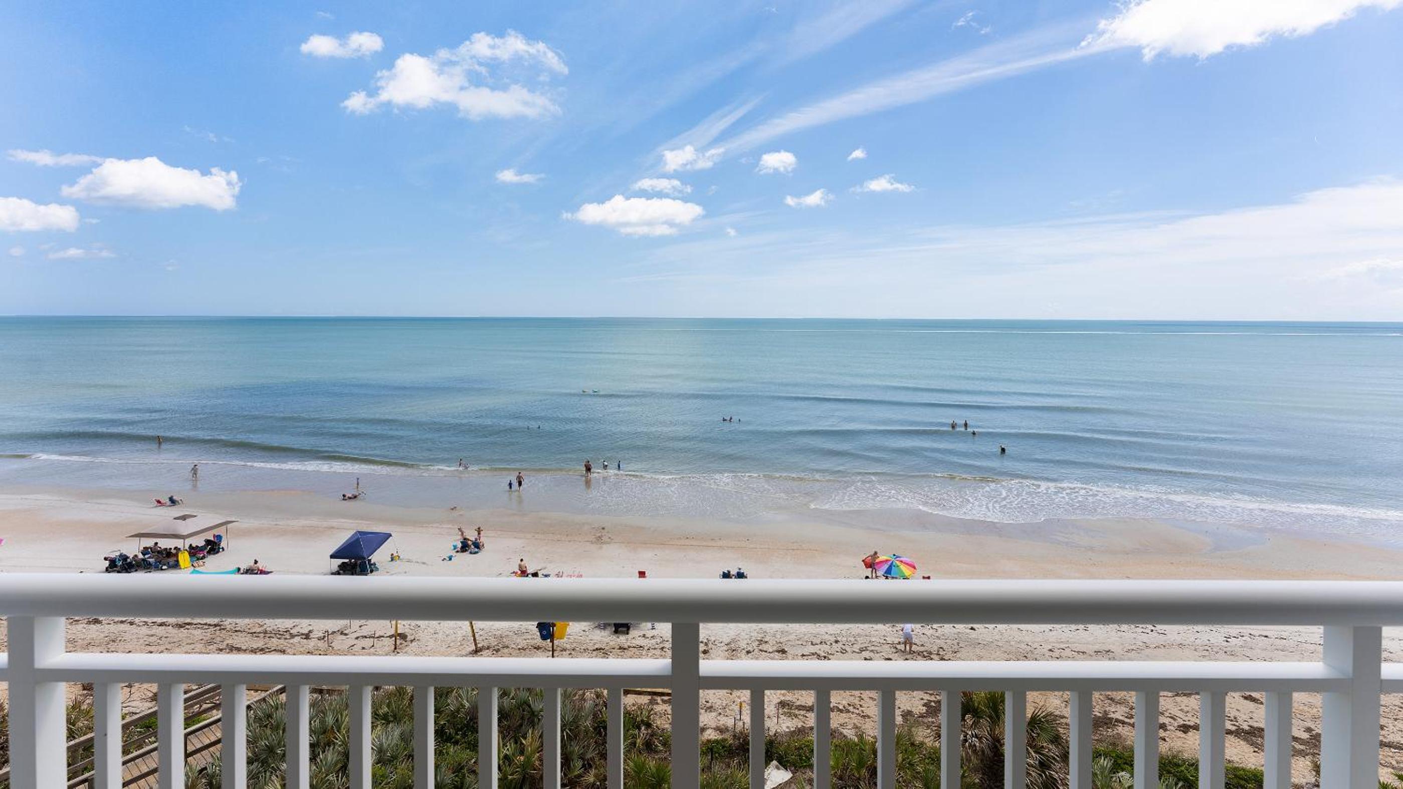 Renovated direct oceanfront corner condo with a huge wrap-around balcony and pool