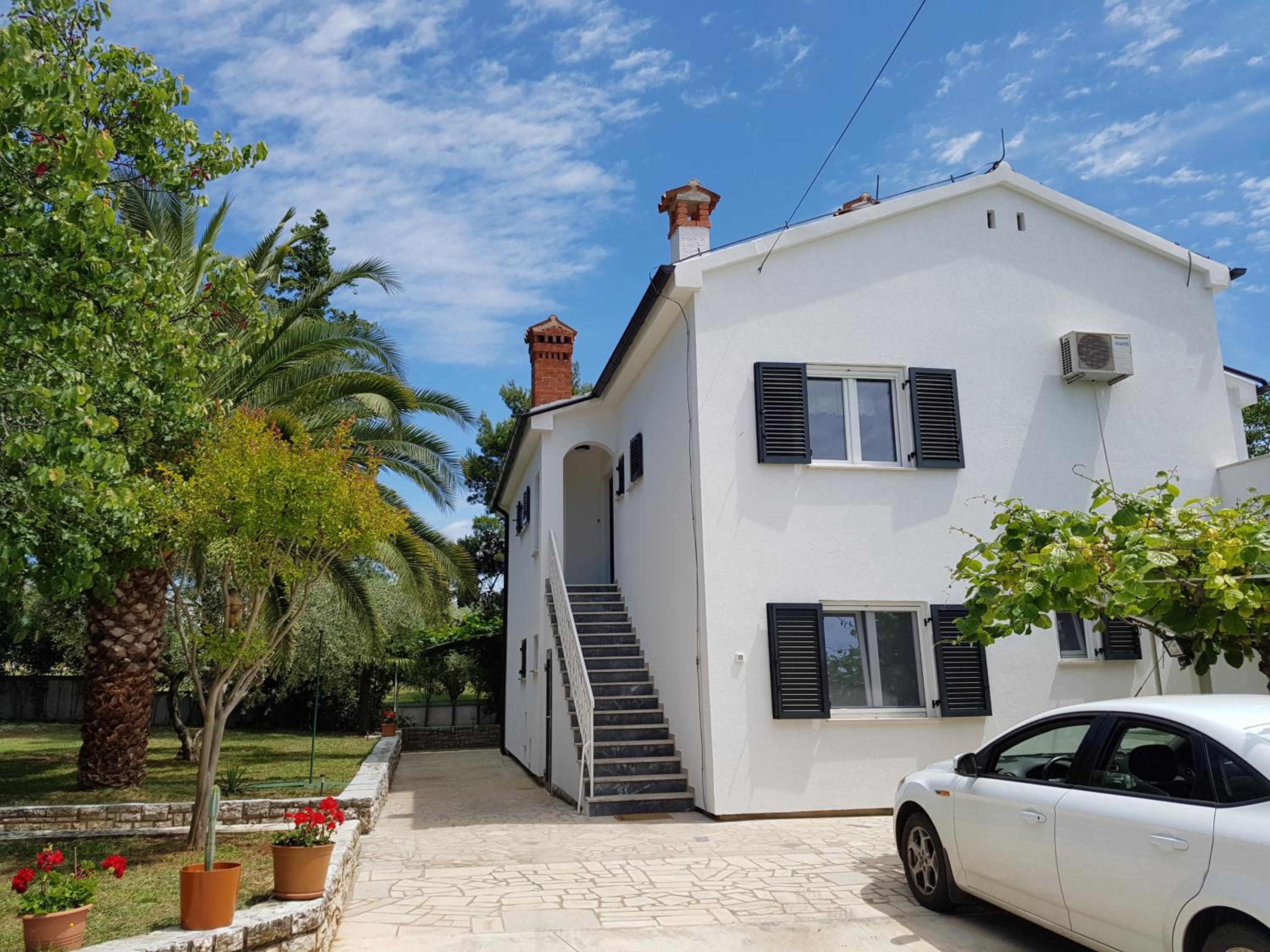 Villa Rosa with yard and children's playground view 2