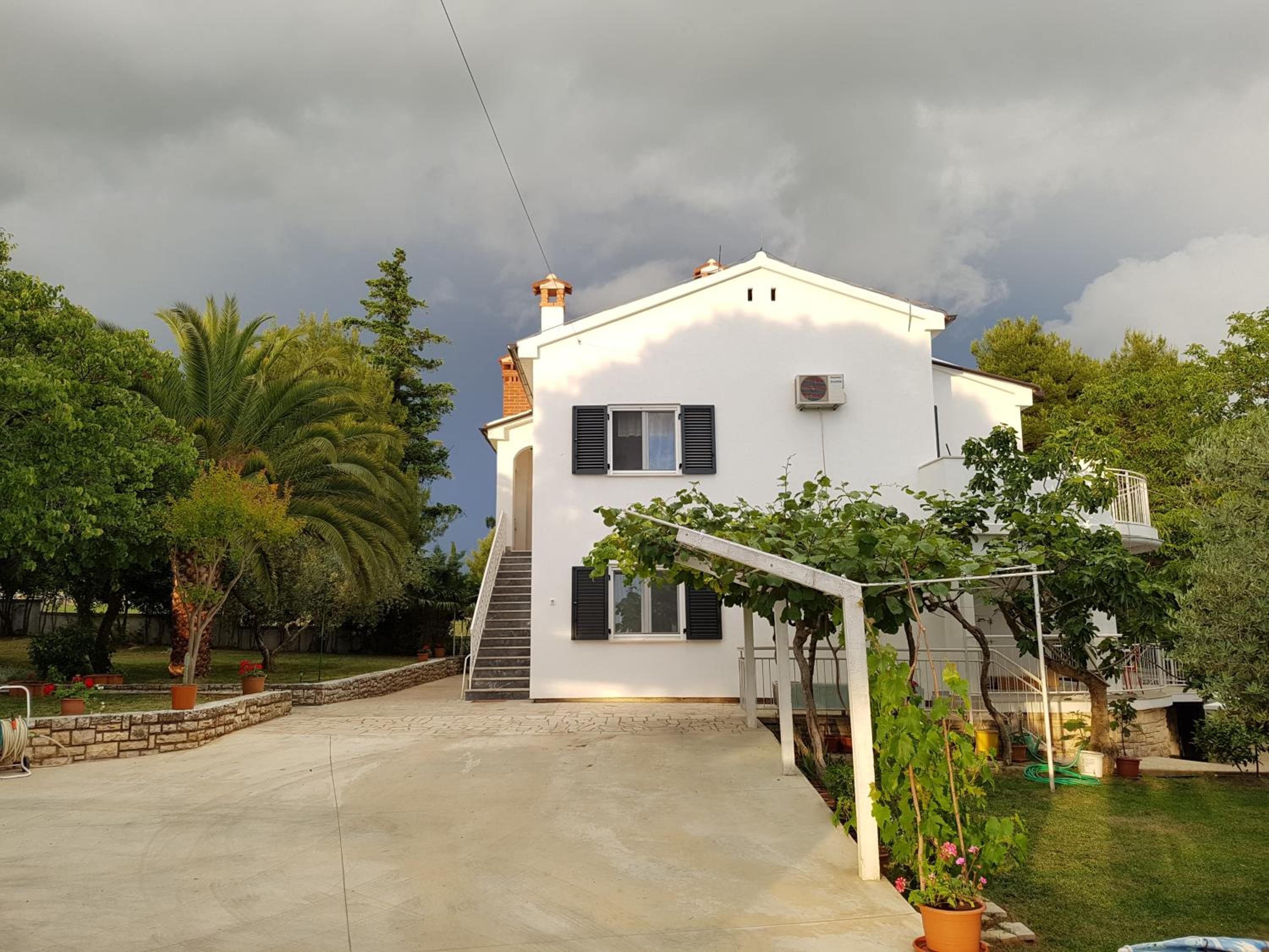 Villa Rosa with yard and children's playground view 4