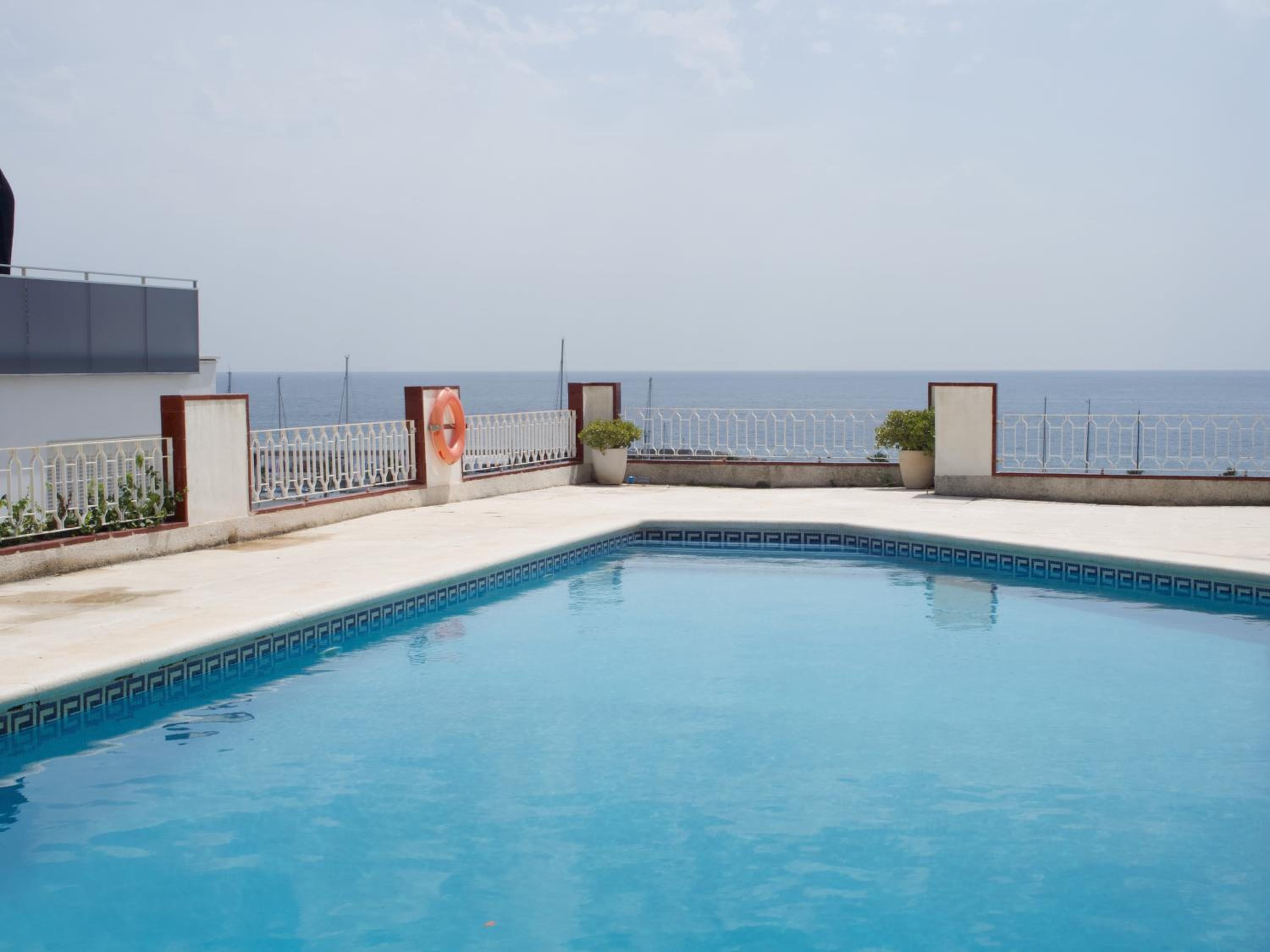 Stunning sea views over marina with swimming pool