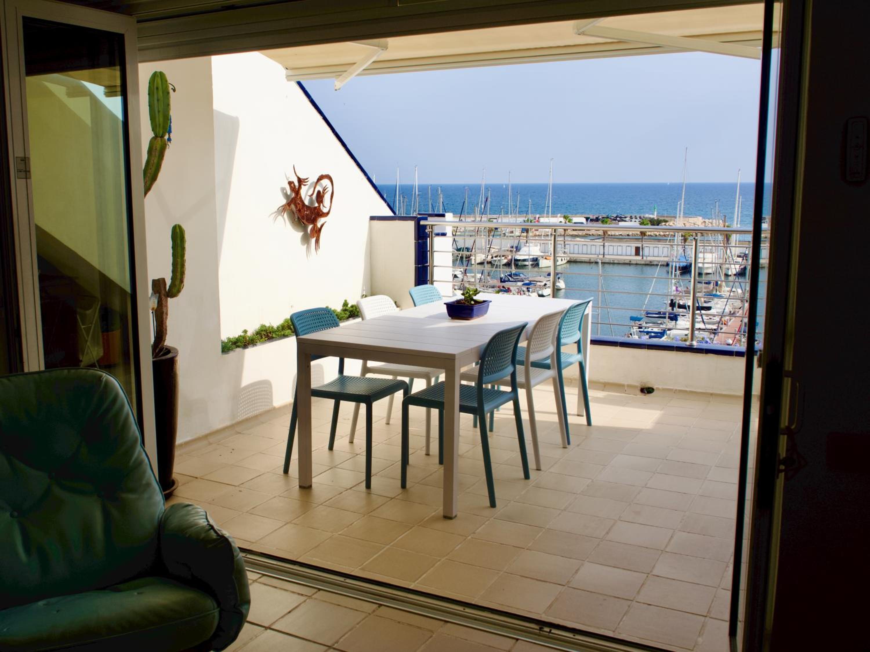 Stunning sea views over marina with swimming pool