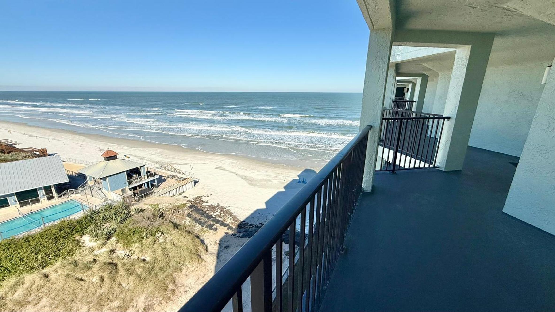 Top-floor ocean view condo with a private balcony and beachfront pool