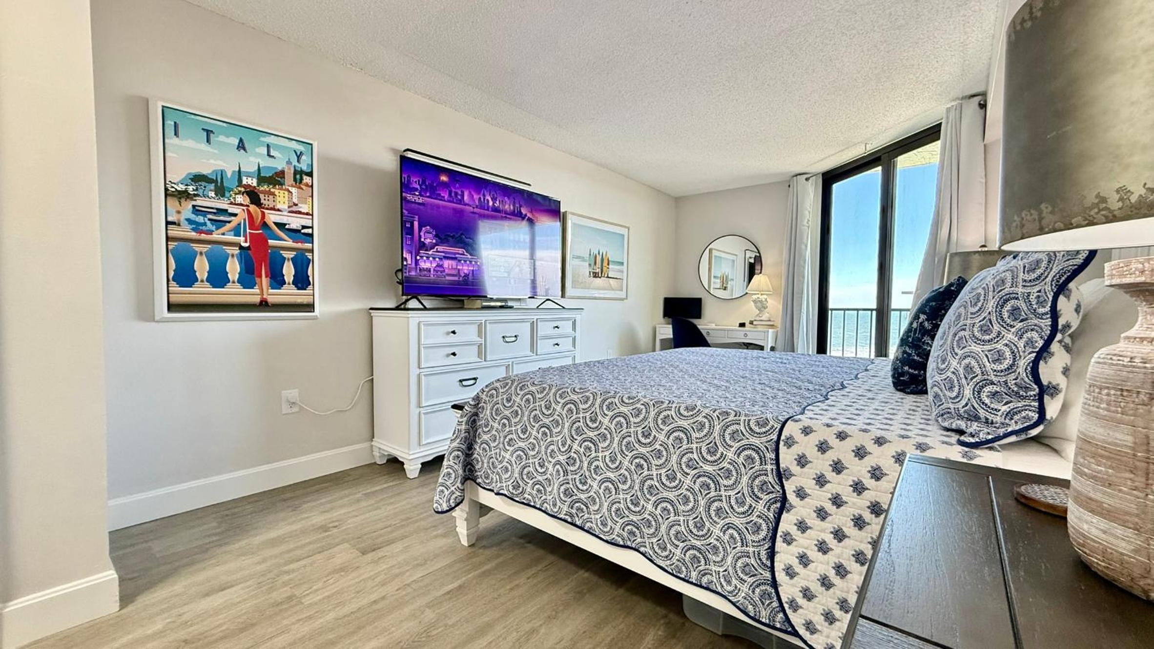 Top-floor ocean view condo with a private balcony and beachfront pool