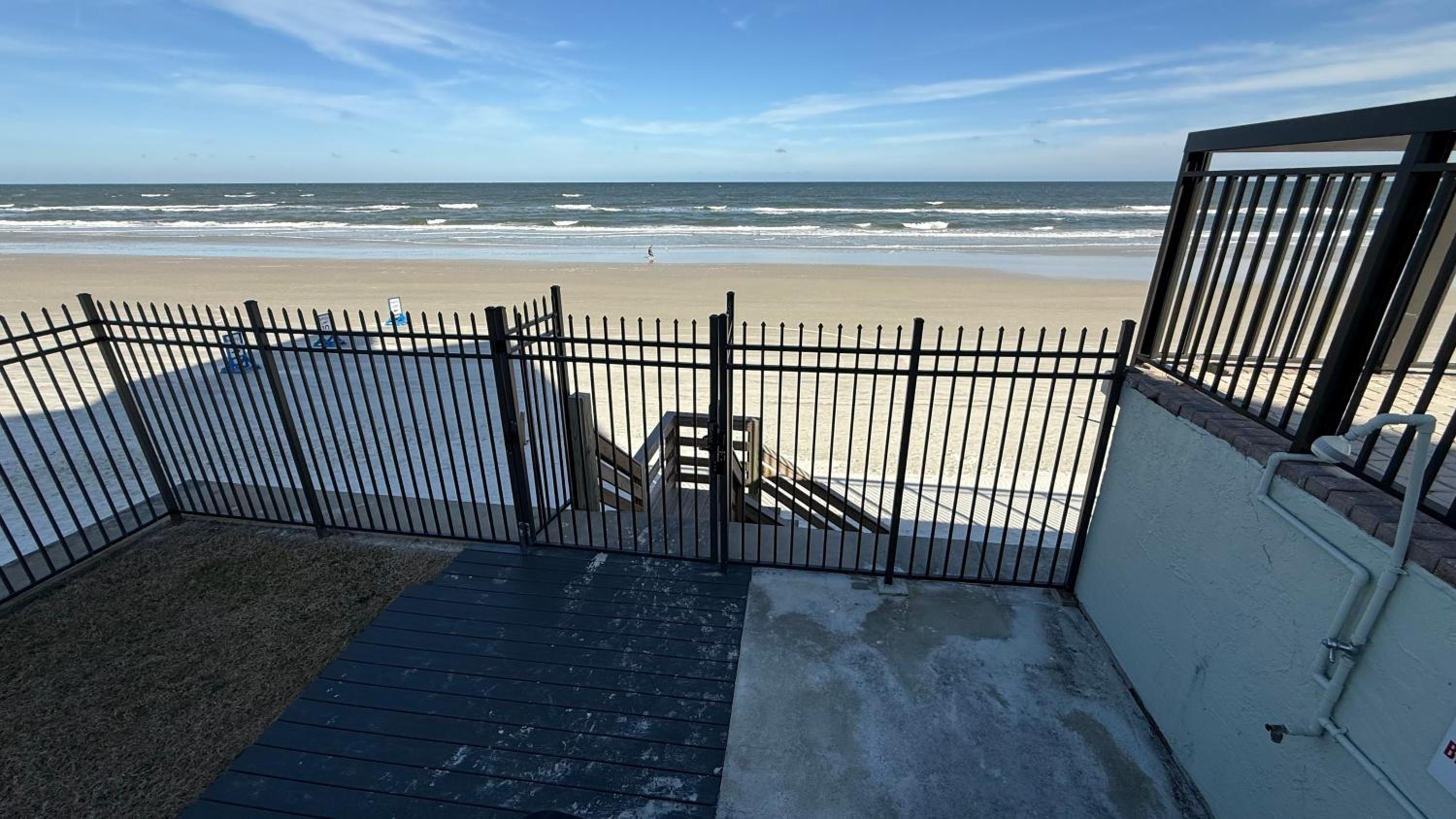 Top-floor ocean view condo with a private balcony and beachfront pool