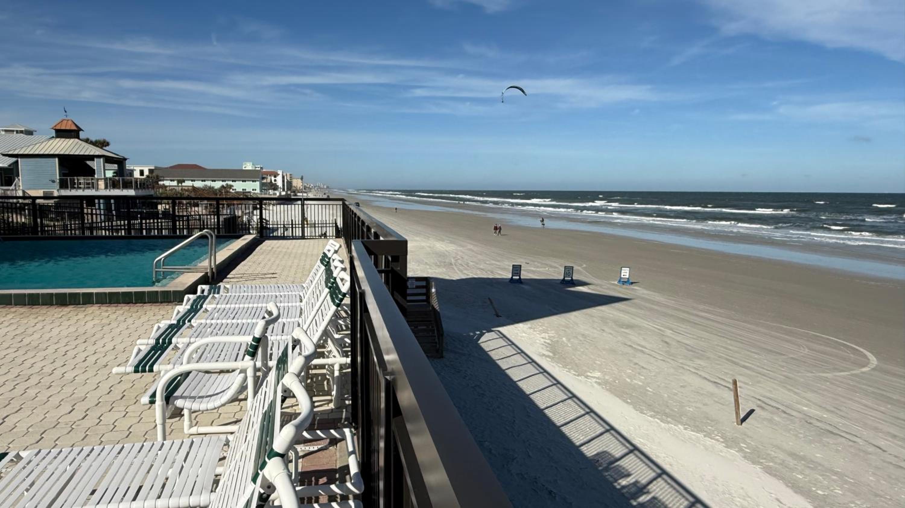 Top-floor ocean view condo with a private balcony and beachfront pool