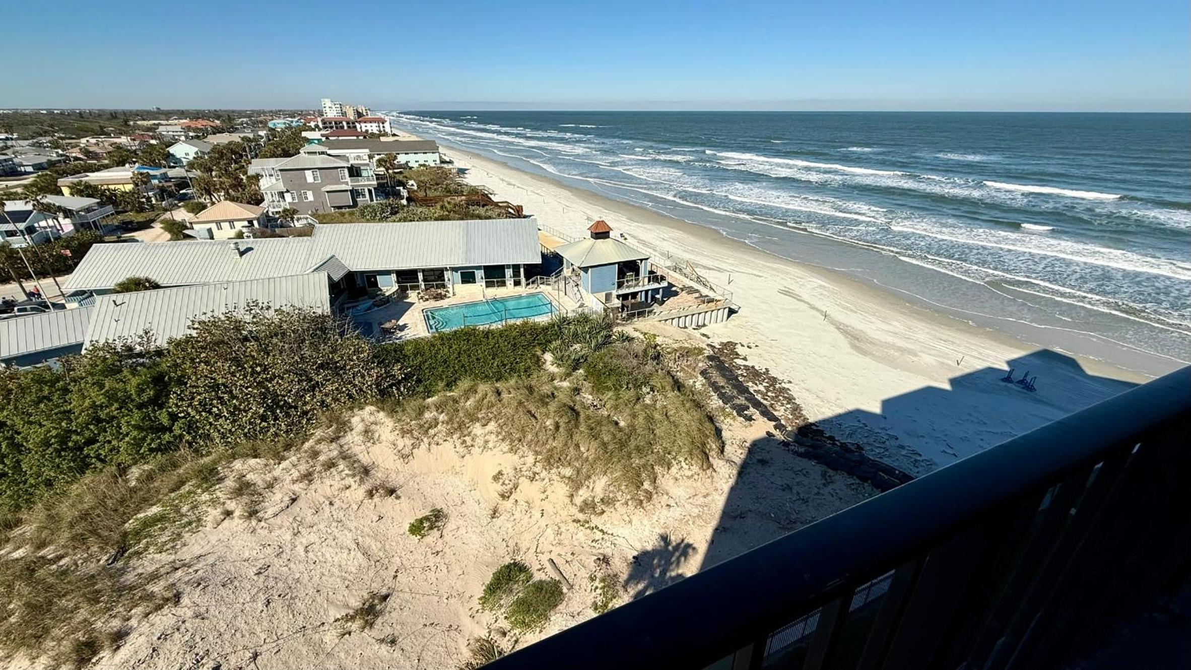 Top-floor ocean view condo with a private balcony and beachfront pool