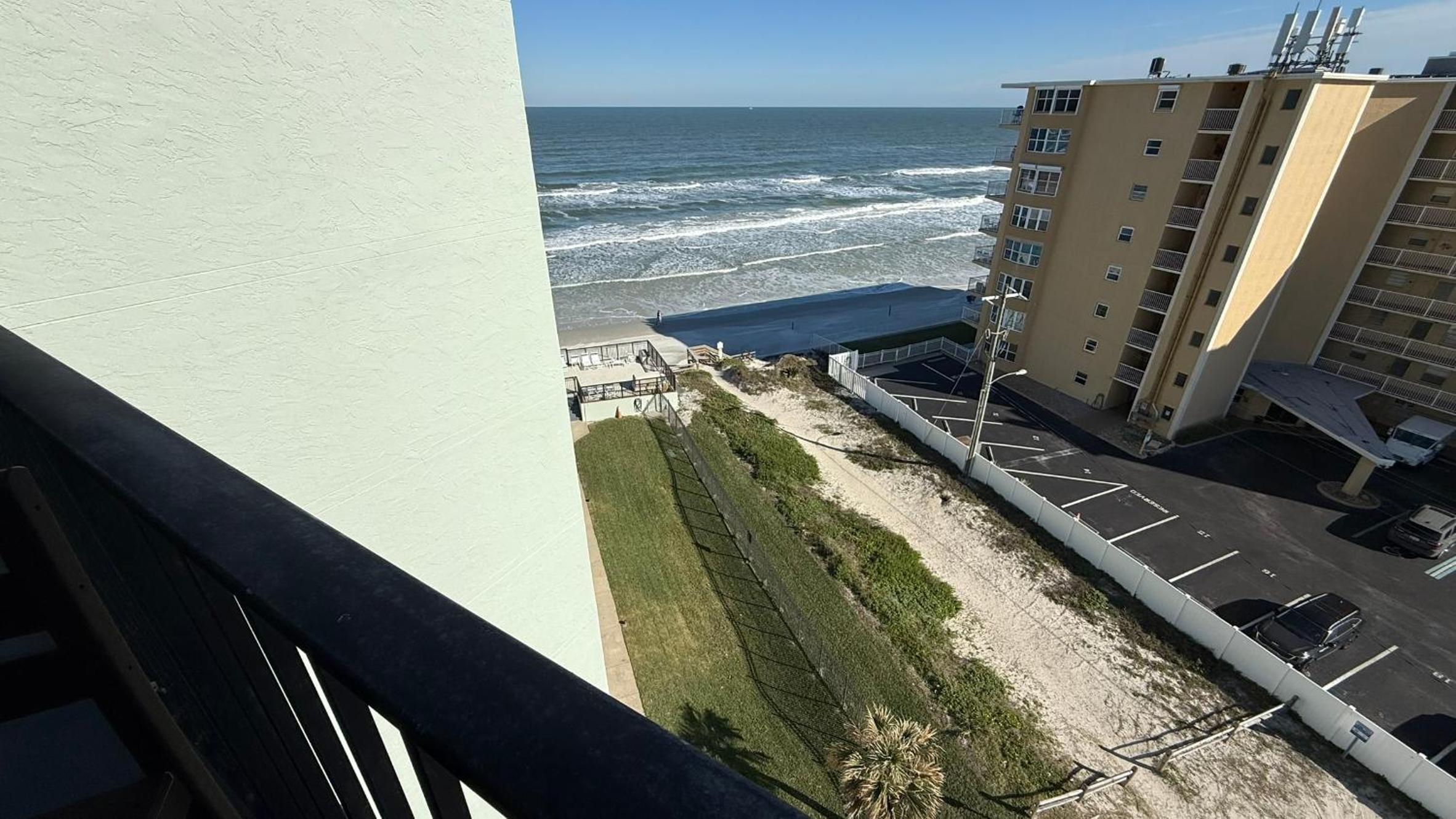 Top-floor ocean view condo with a private balcony and beachfront pool