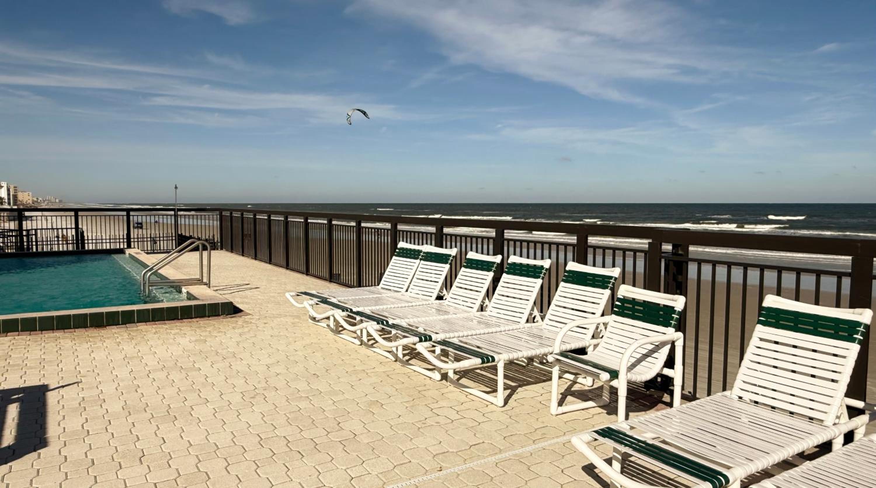 Top-floor ocean view condo with a private balcony and beachfront pool