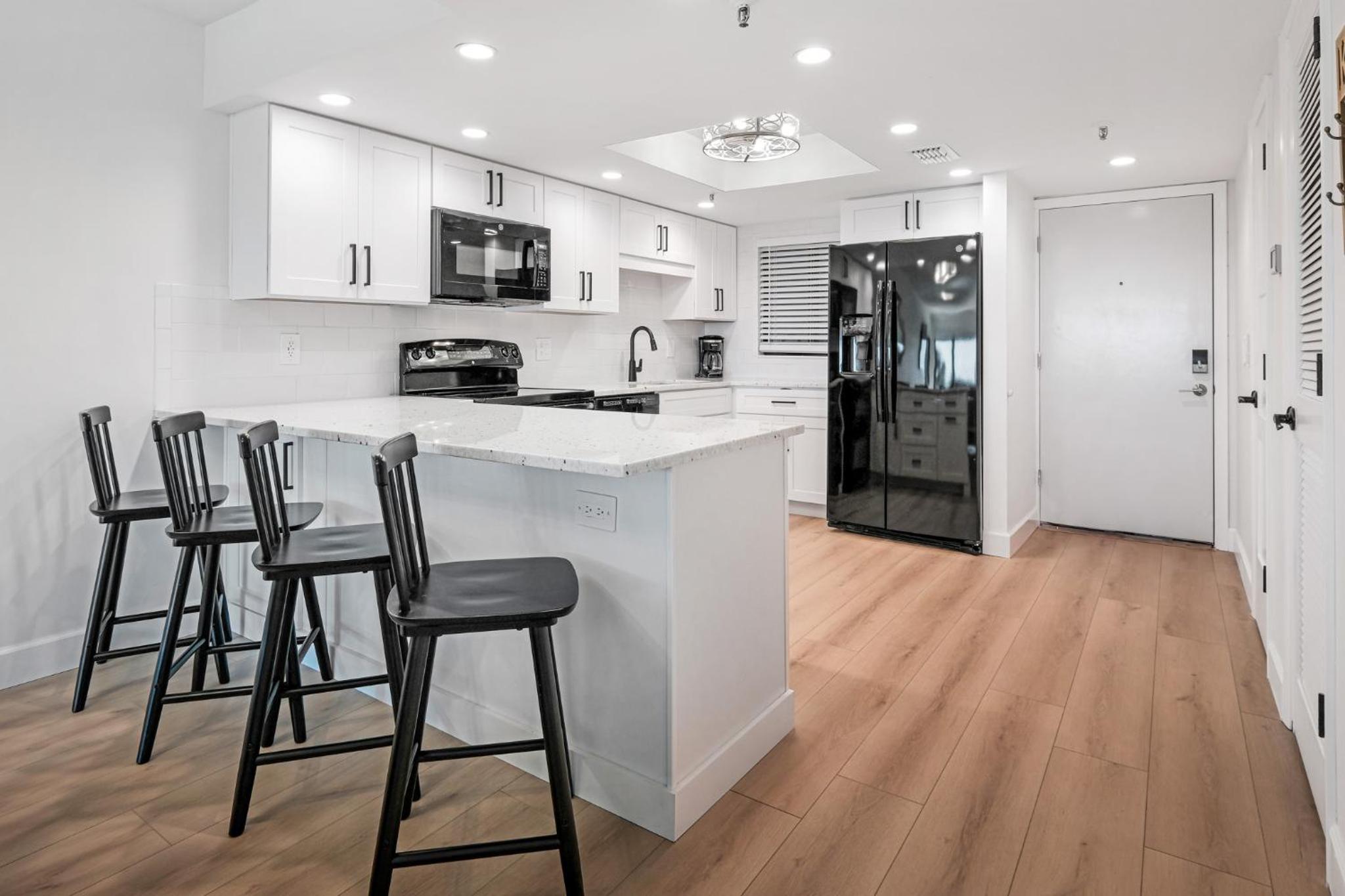 Updated direct oceanfront, ground floor condo with a heated pool and beach access