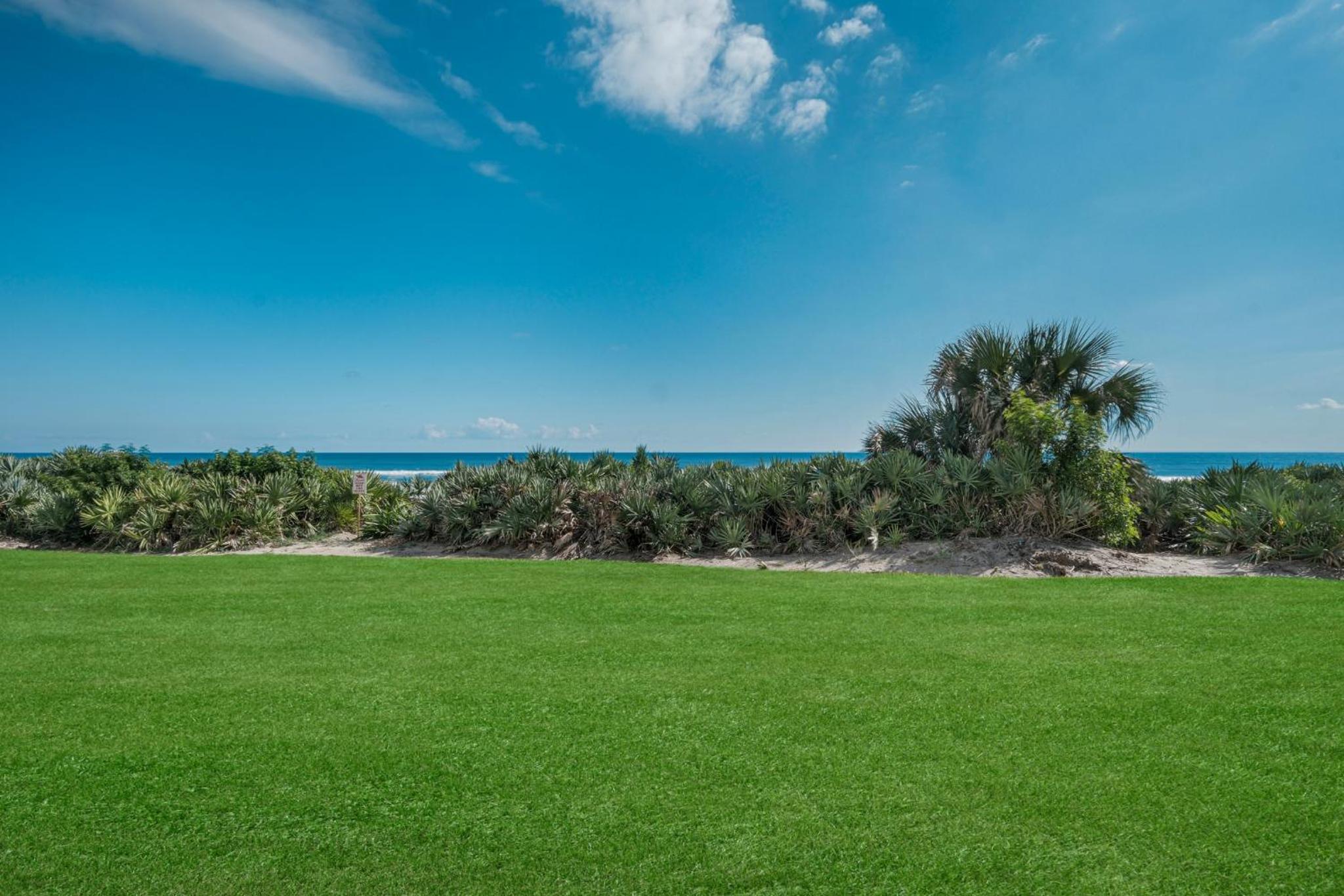 Updated direct oceanfront, ground floor condo with a heated pool and beach access