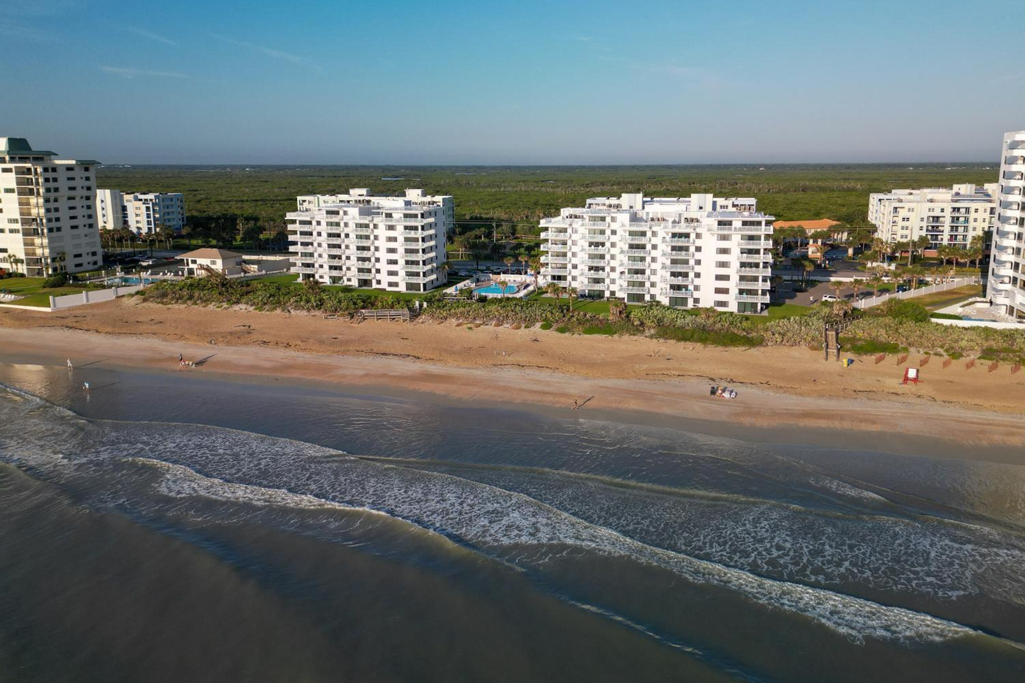 Updated direct oceanfront, ground floor condo with a heated pool and beach access