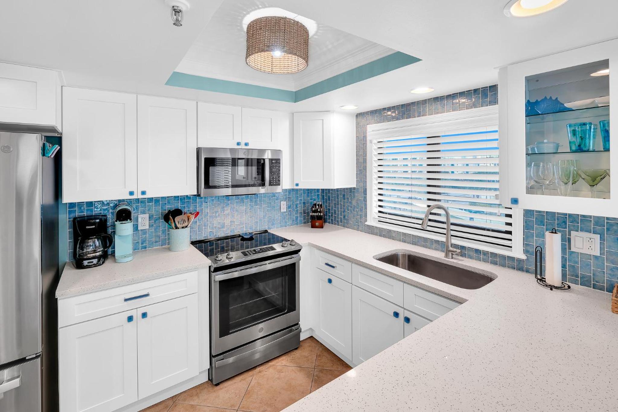Updated direct oceanfront corner with a wrap-around balcony, heated pool and beach access