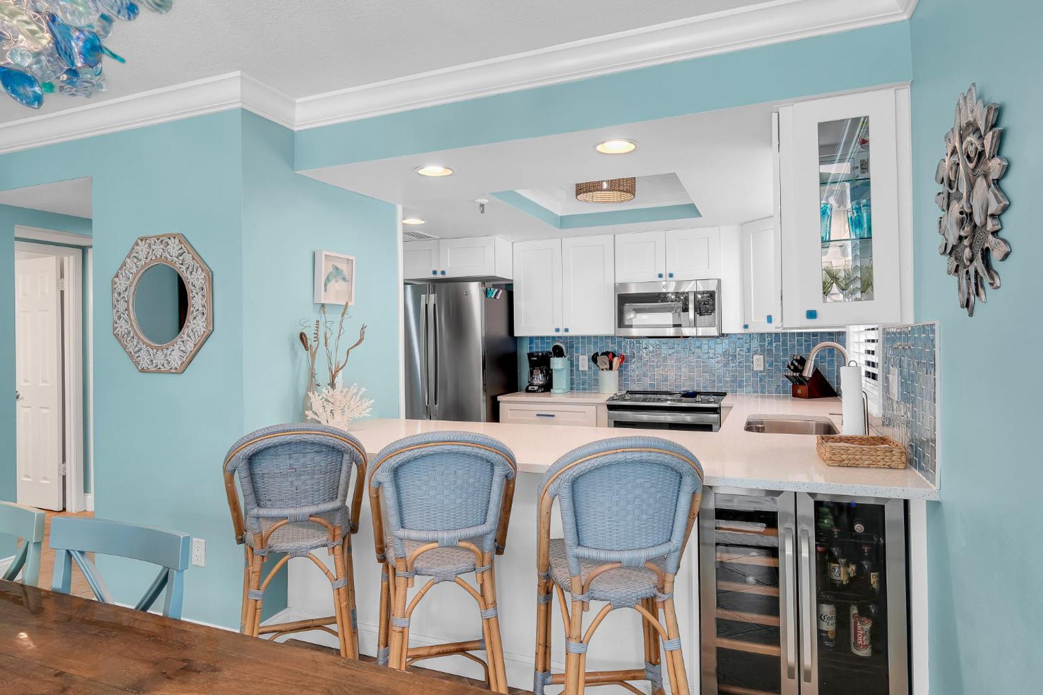 Updated direct oceanfront corner with a wrap-around balcony, heated pool and beach access