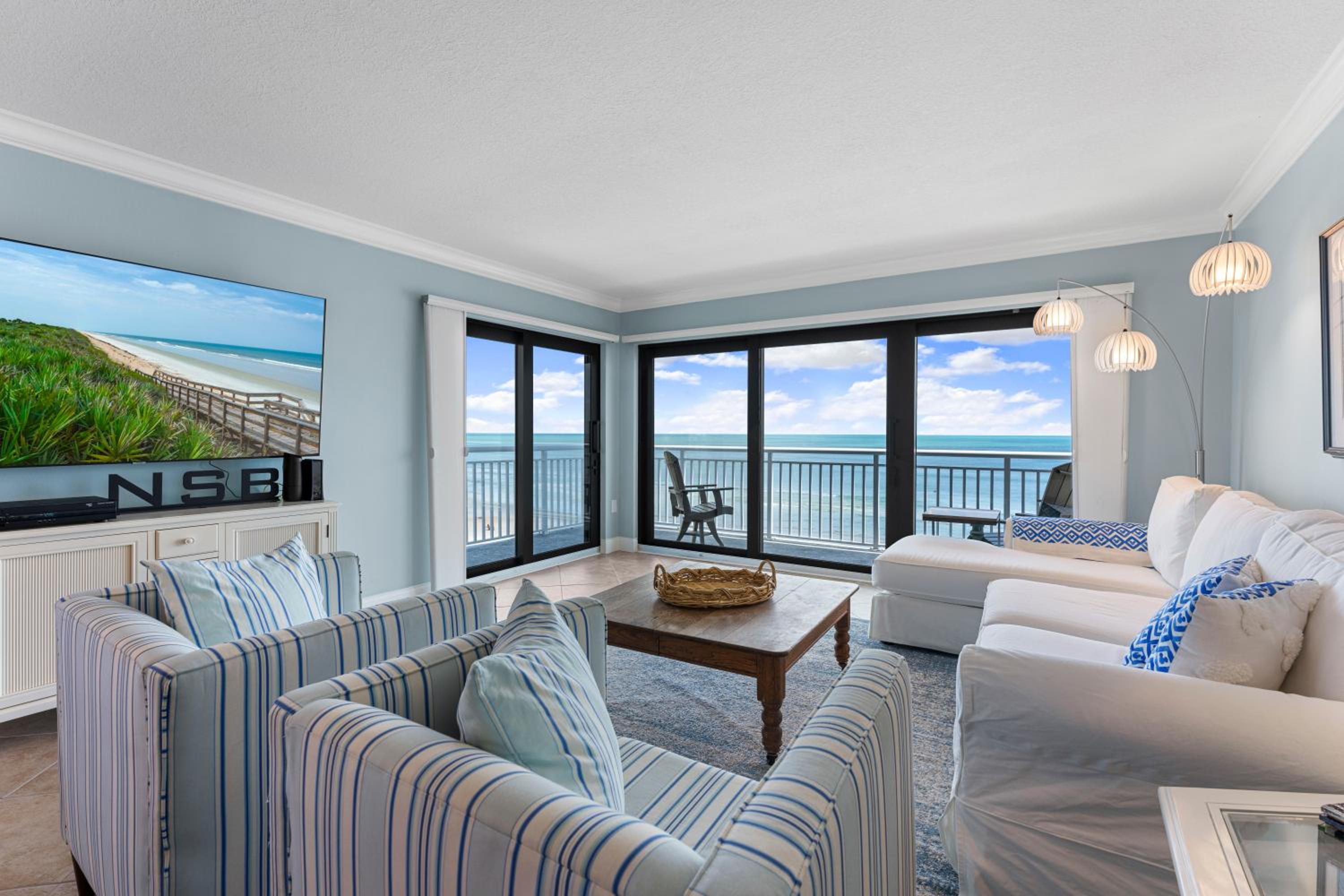 Updated direct oceanfront corner with a wrap-around balcony, heated pool and beach access