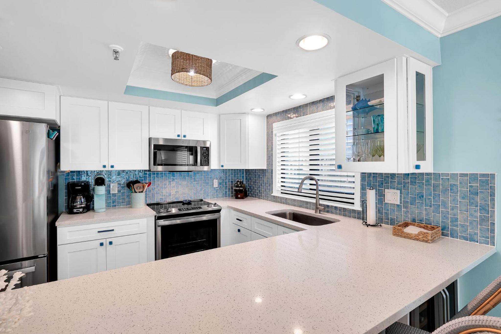 Updated direct oceanfront corner with a wrap-around balcony, heated pool and beach access