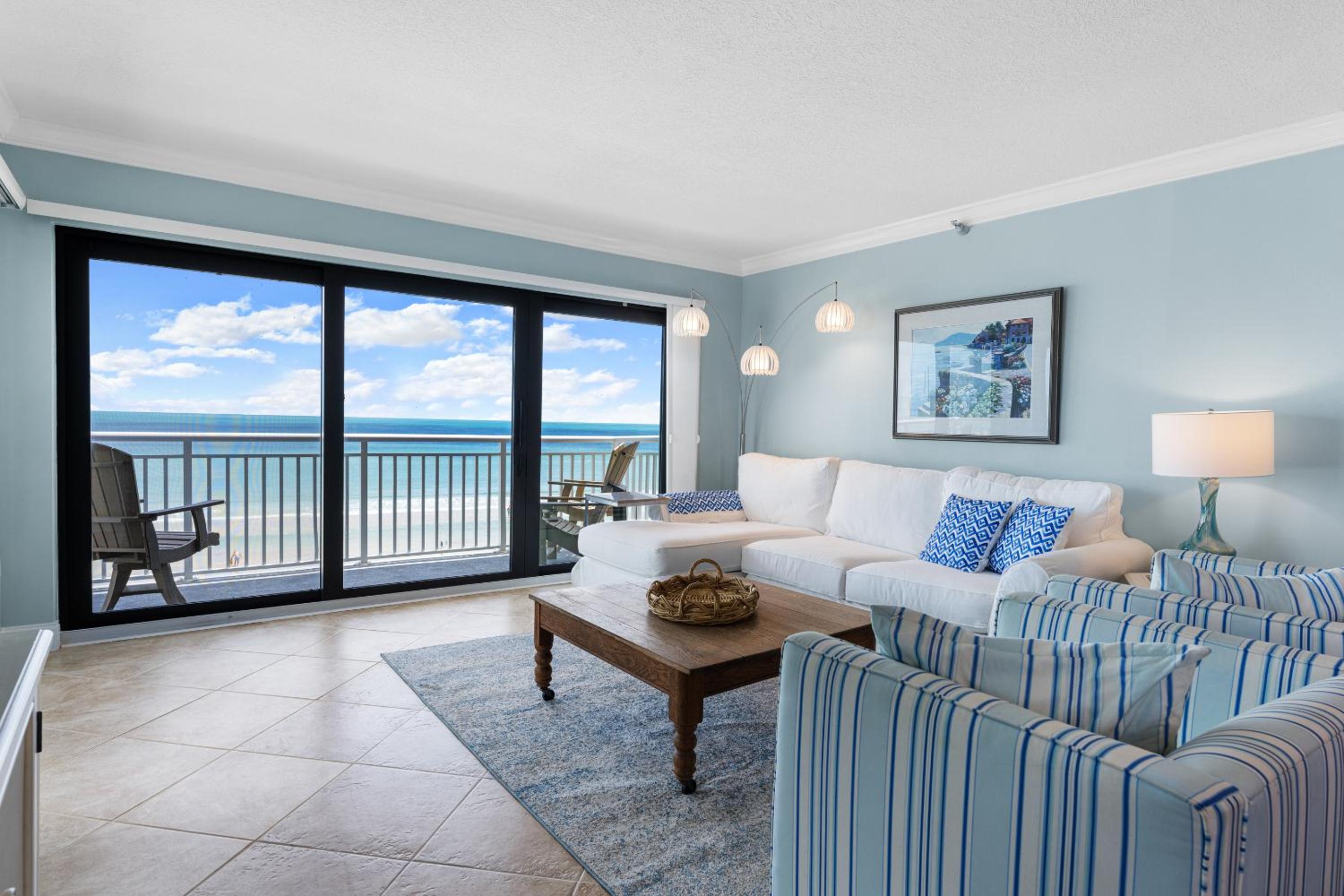 Updated direct oceanfront corner with a wrap-around balcony, heated pool and beach access