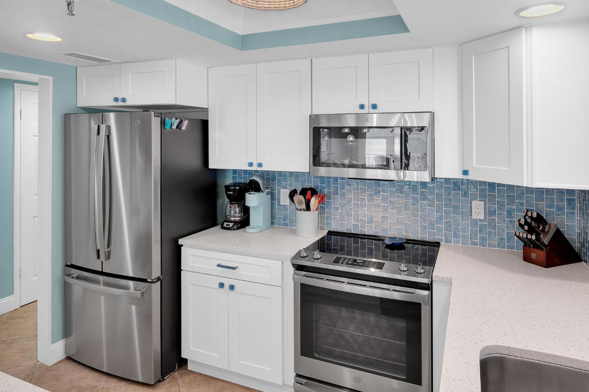 Updated direct oceanfront corner with a wrap-around balcony, heated pool and beach access