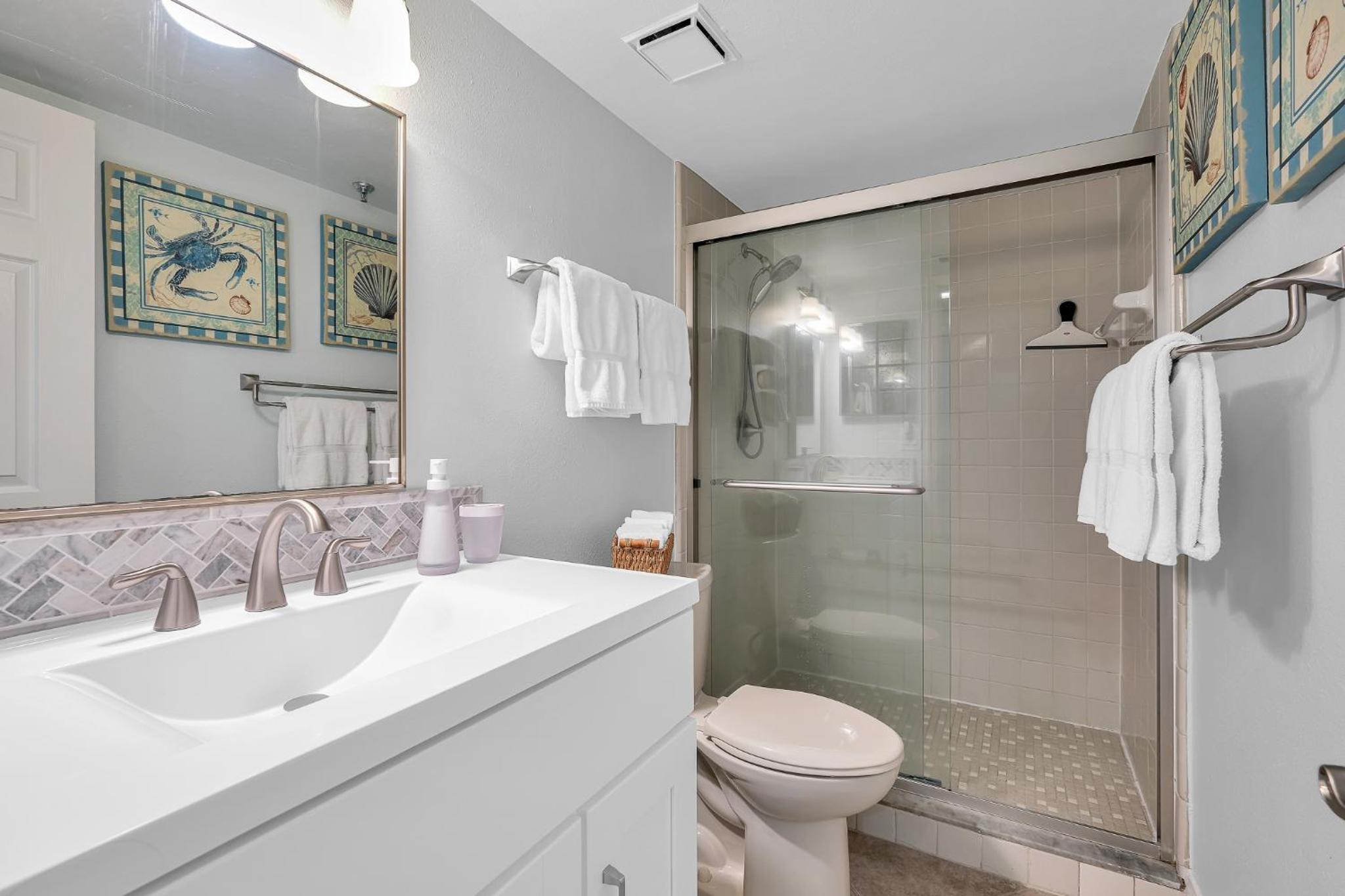 Updated direct oceanfront corner with a wrap-around balcony, heated pool and beach access
