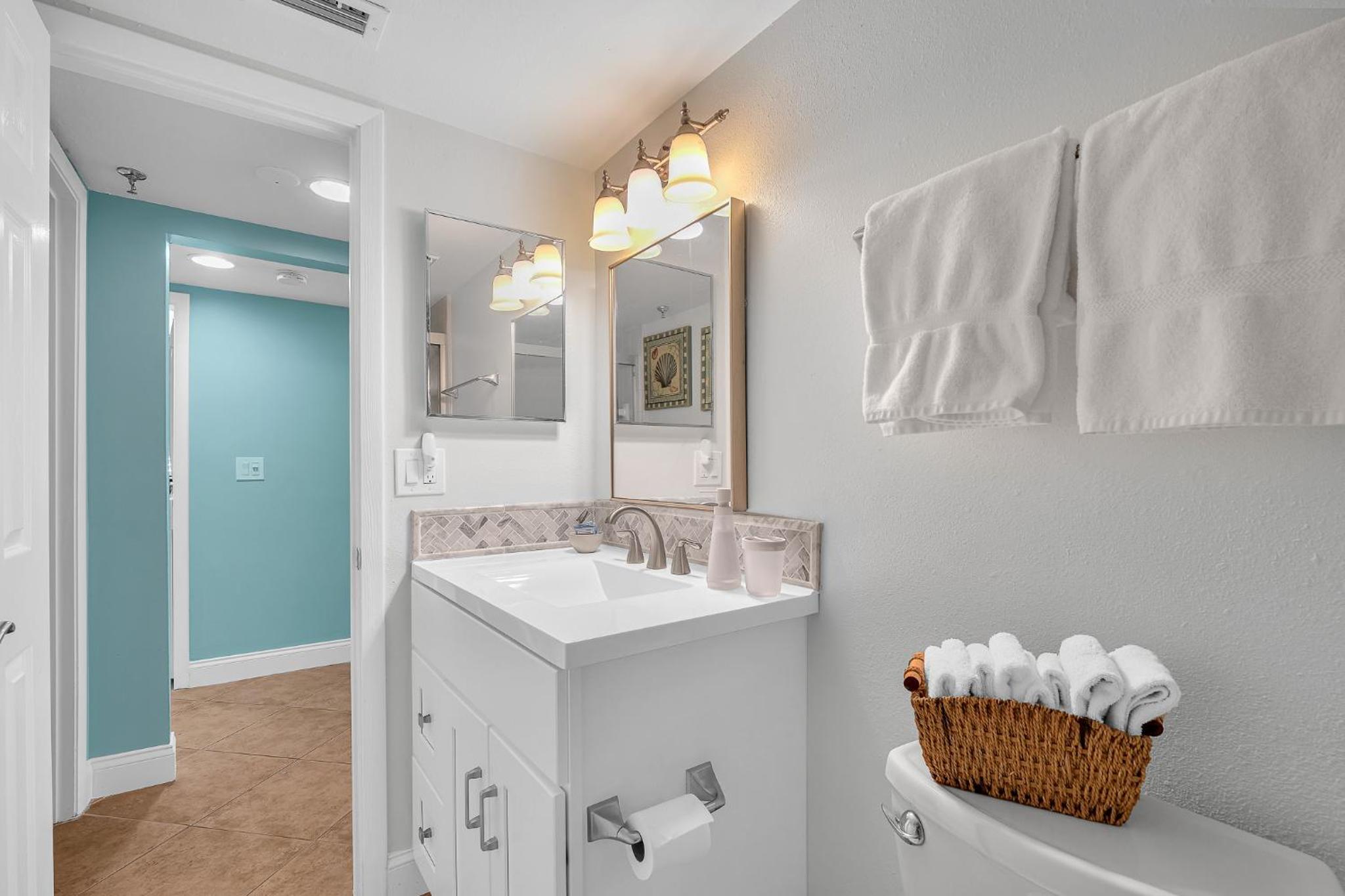 Updated direct oceanfront corner with a wrap-around balcony, heated pool and beach access